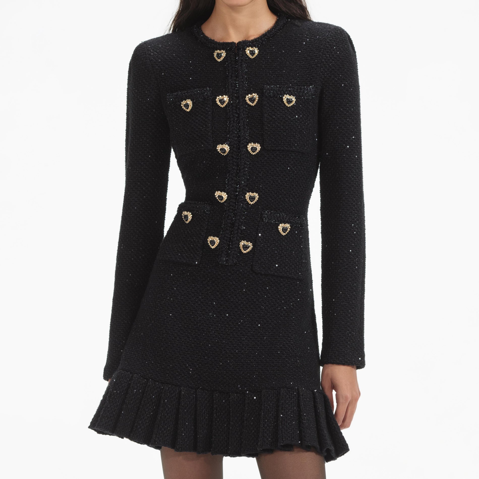 A close up of a woman wearing the Black Buttoned Knit Mini Dress
