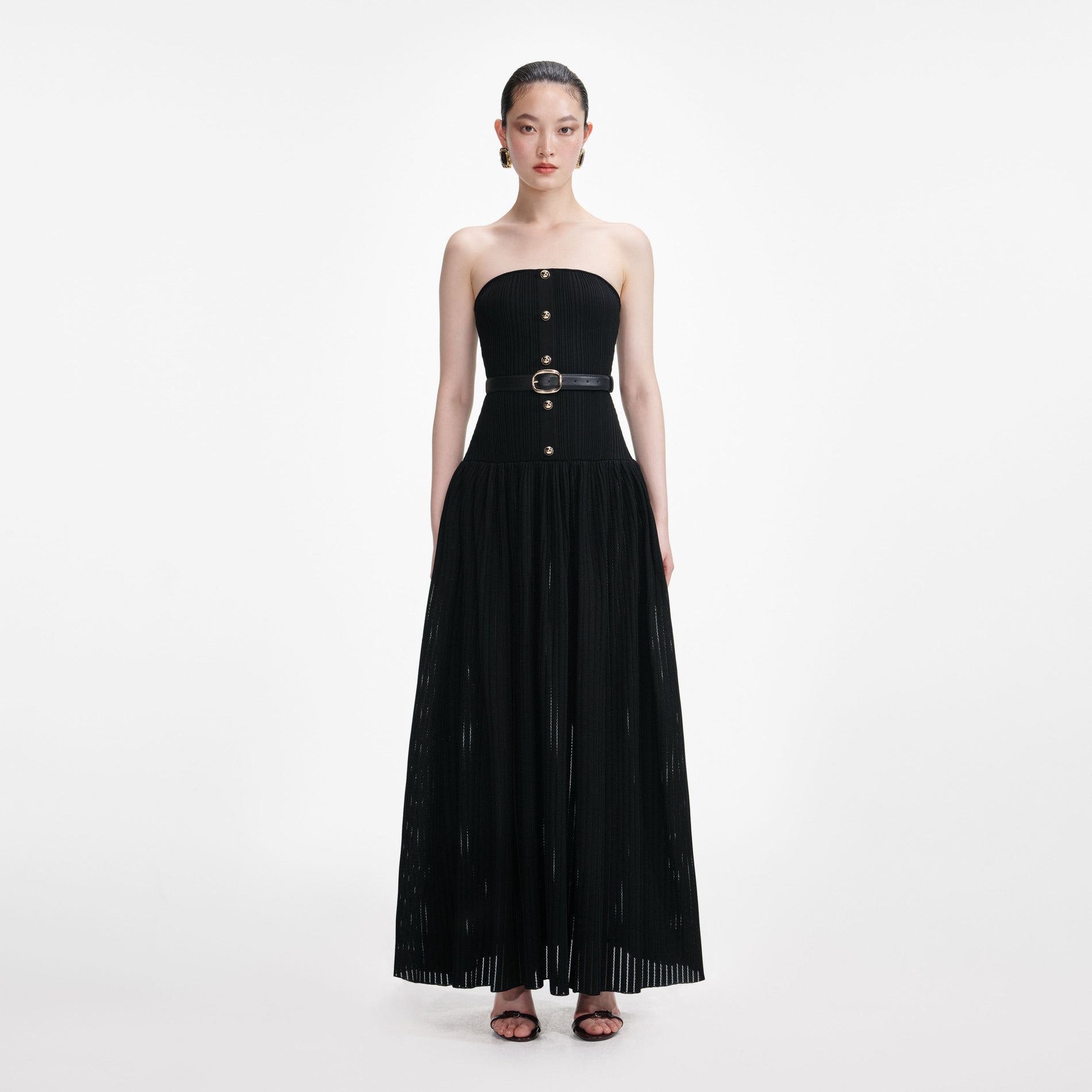 Front view of a woman wearing the Black Bandeau Knit Maxi Dress