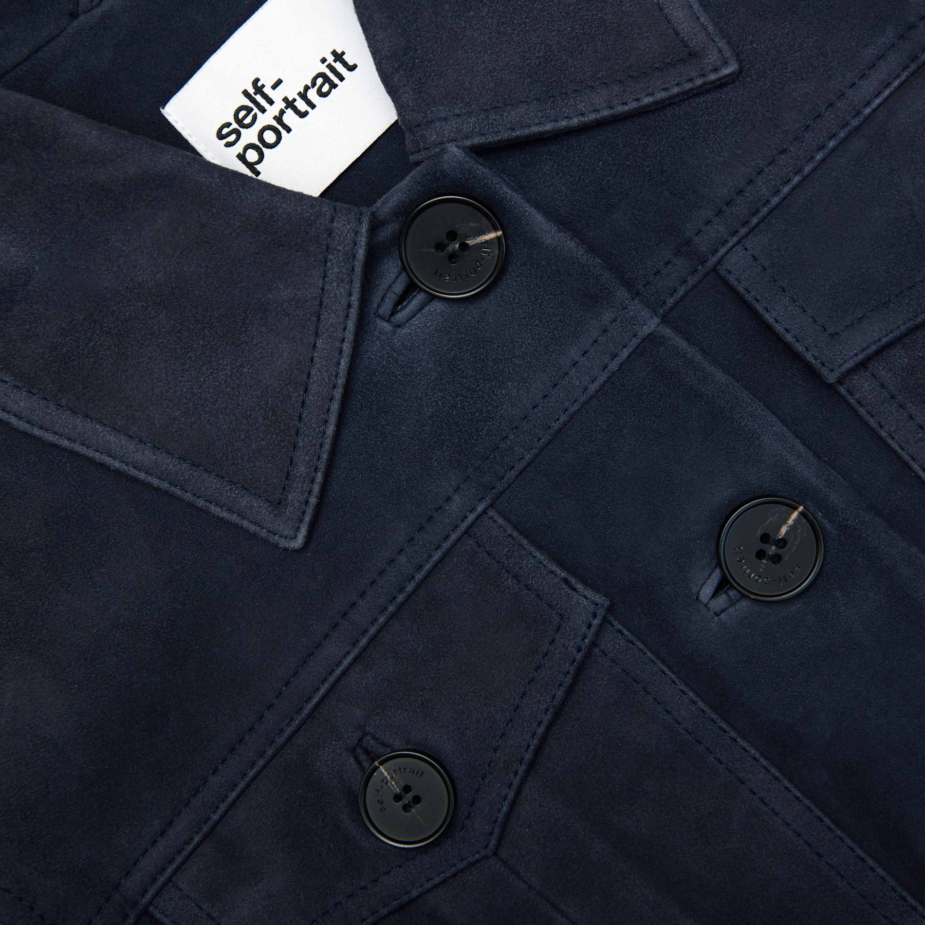 A close up of the fabric for the Navy Suede Jacket