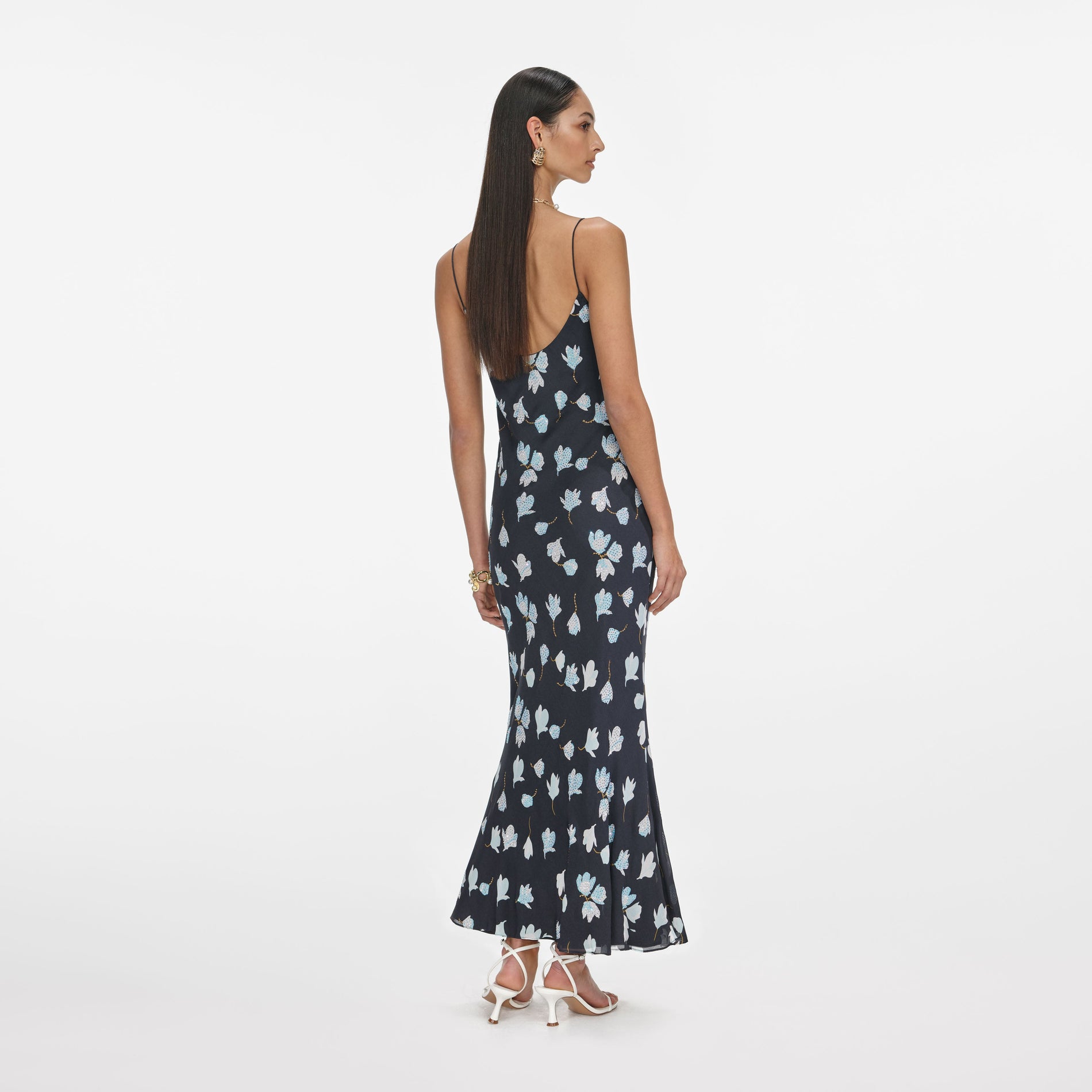 Back view of a woman wearing the Navy Floral Rhinestone Midi Dress