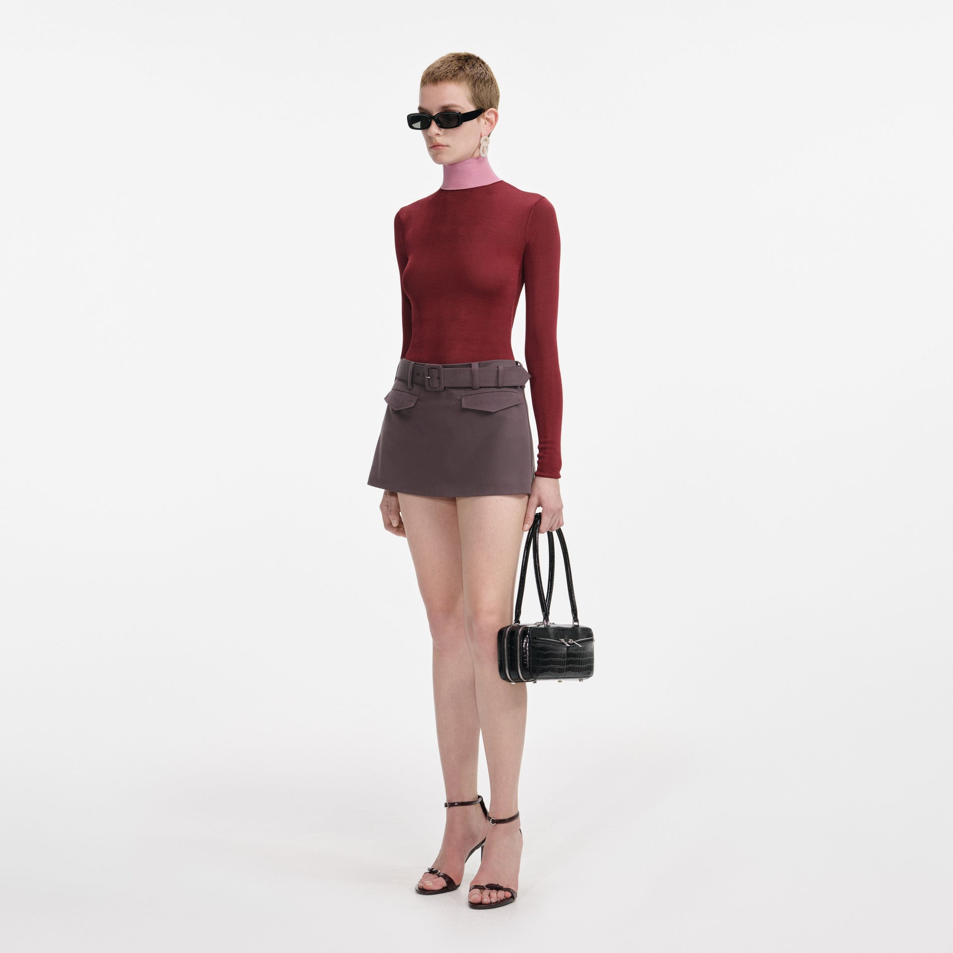 Side view of a woman wearing the Burgundy Contrast Viscose Knit Top