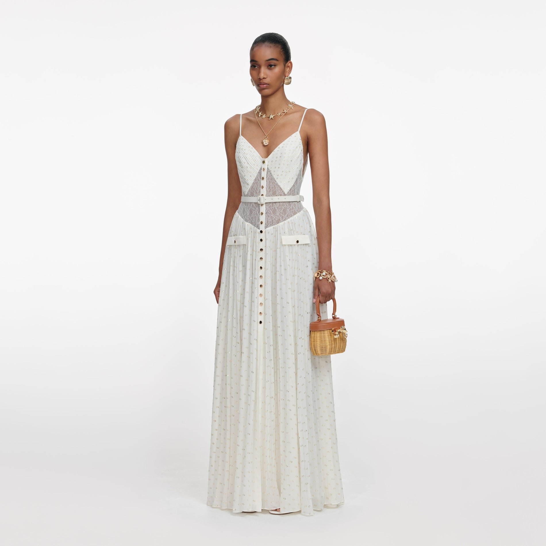 Side view of a woman wearing the Cream And Gold Chiffon Maxi Dress