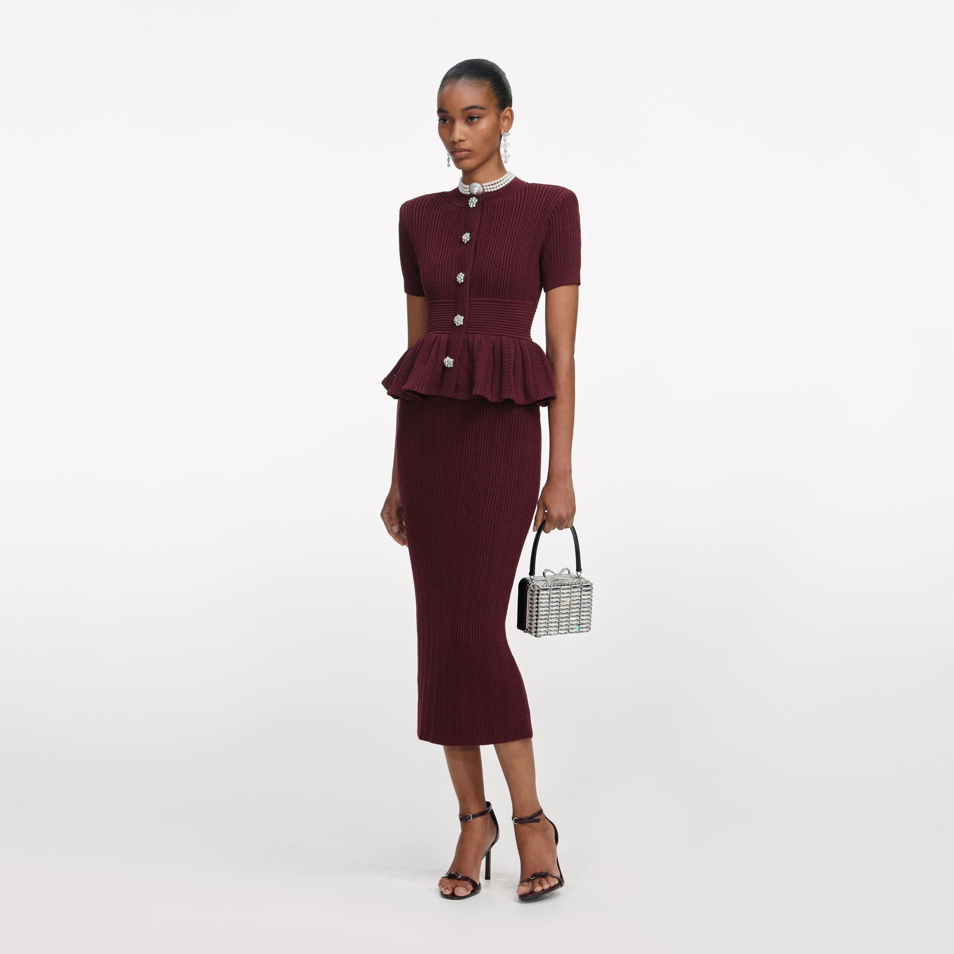 Side view of a woman wearing the Bordeaux Pointelle Knit Midi Dress