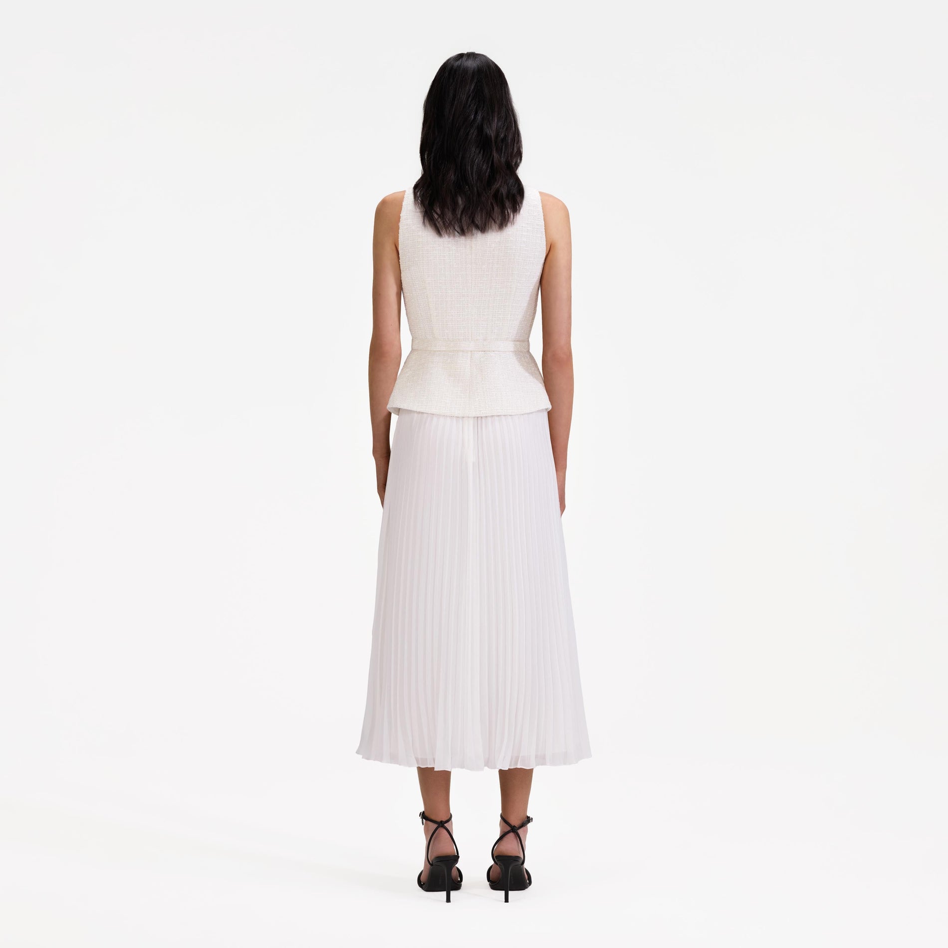 Back view of a woman wearing the Cream Boucle Bodice Chiffon Midi Dress