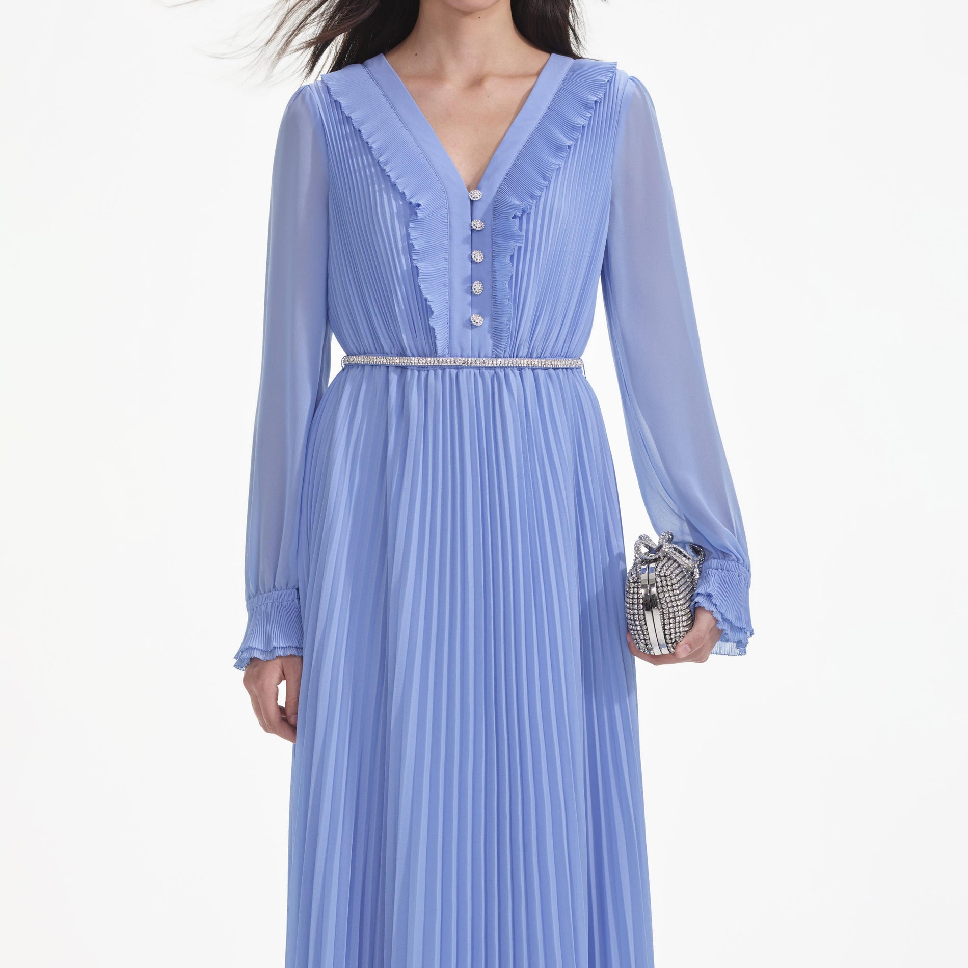 A close up of a woman wearing the Blue Chiffon Maxi Dress