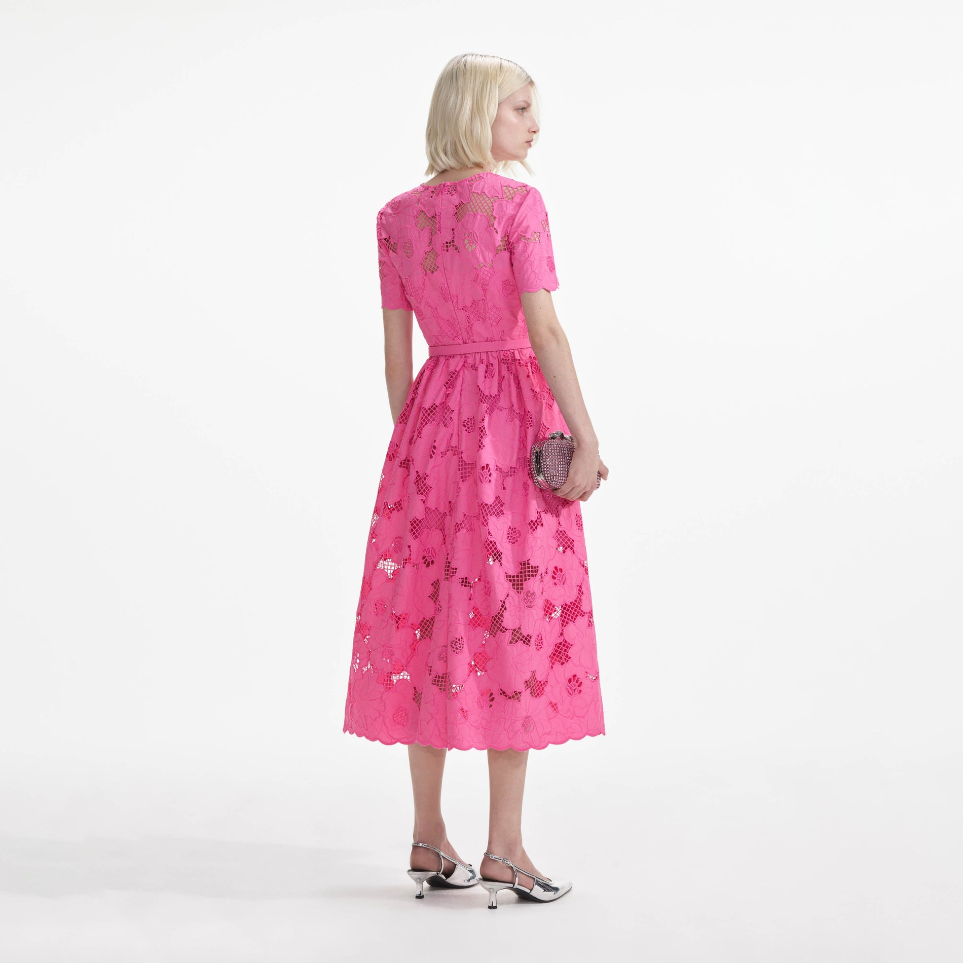 Back view of a woman wearing the Pink Cotton Lace  Midi Dress