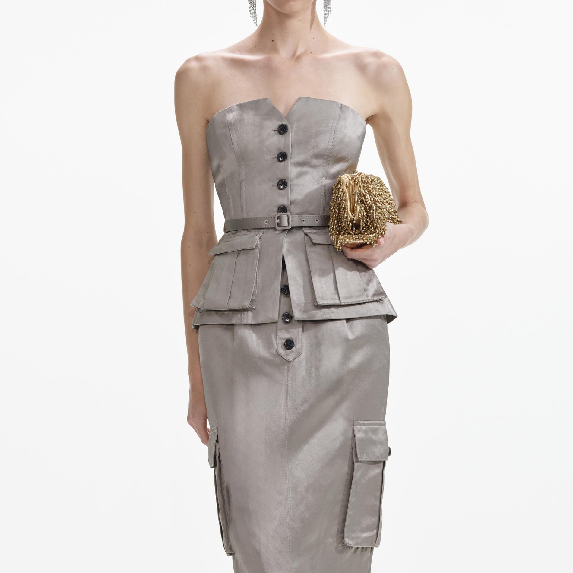 A close up of a woman wearing the Taupe Satin Corset Top