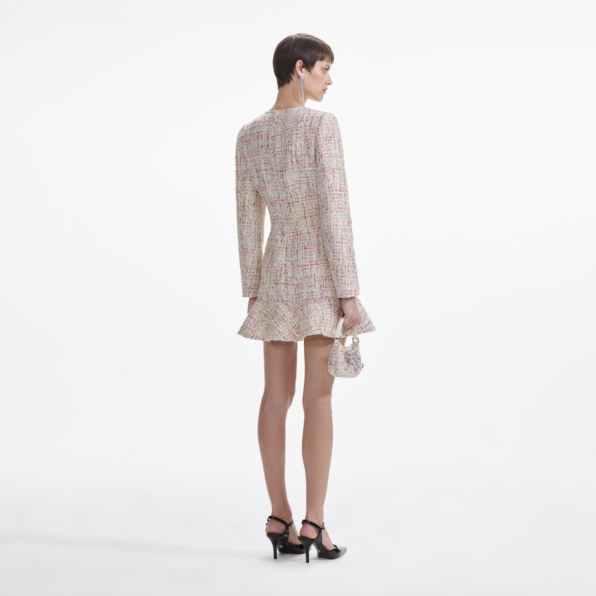 Back view of a woman wearing the Pastel Boucle V-Neck Mini Dress