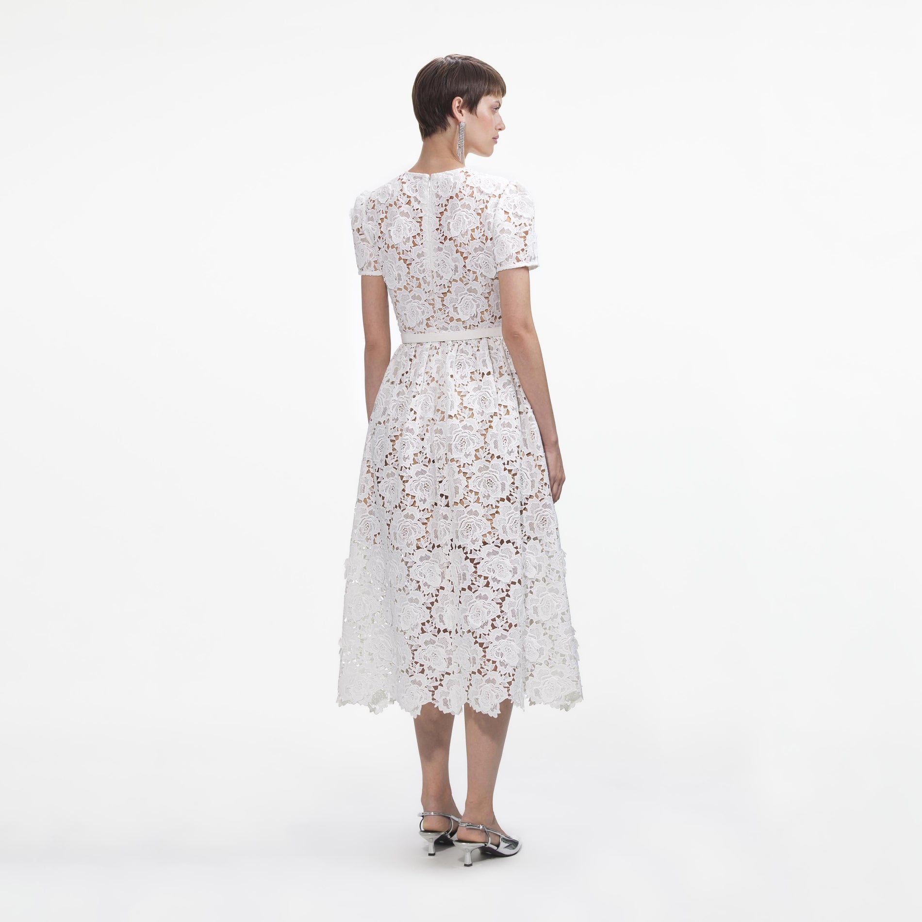 Back view of a woman wearing the White Floral Lace Midi Dress