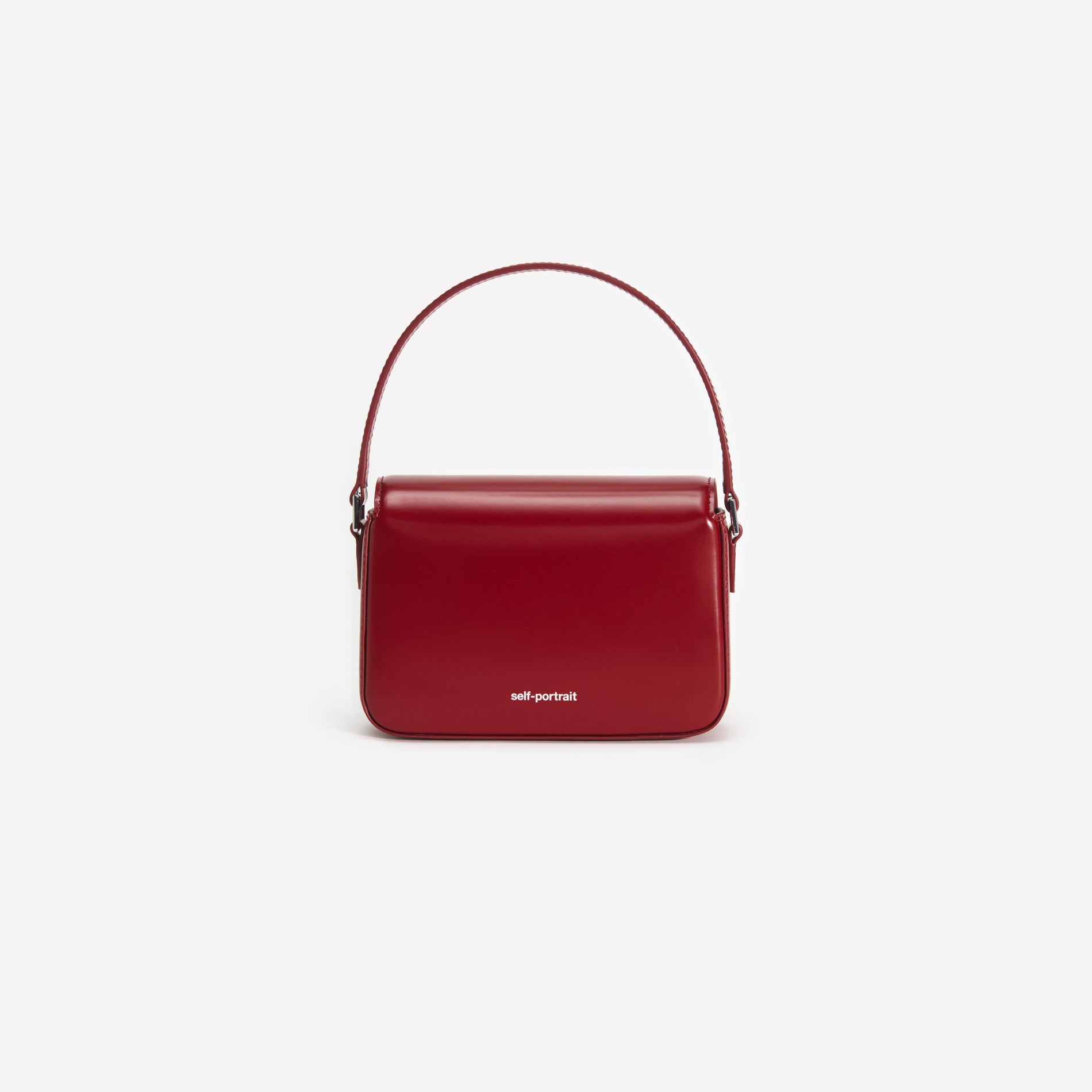 Back view of a woman wearing the Burgundy Leather Micro Bag