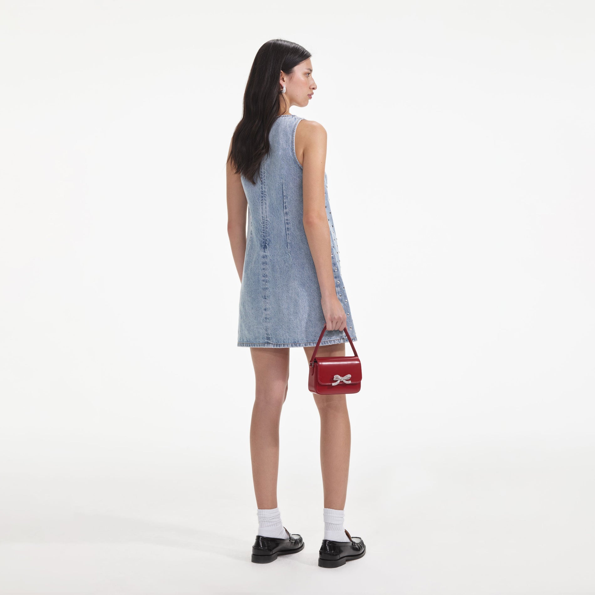 Back view of a woman wearing the Square Rhinestone Denim Mini Dress