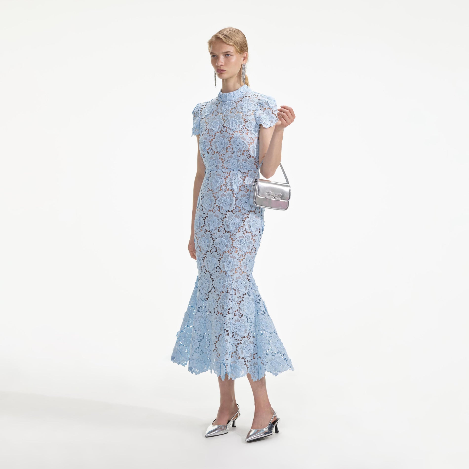 Side view of a woman wearing the Blue Flower Lace Midi Dress