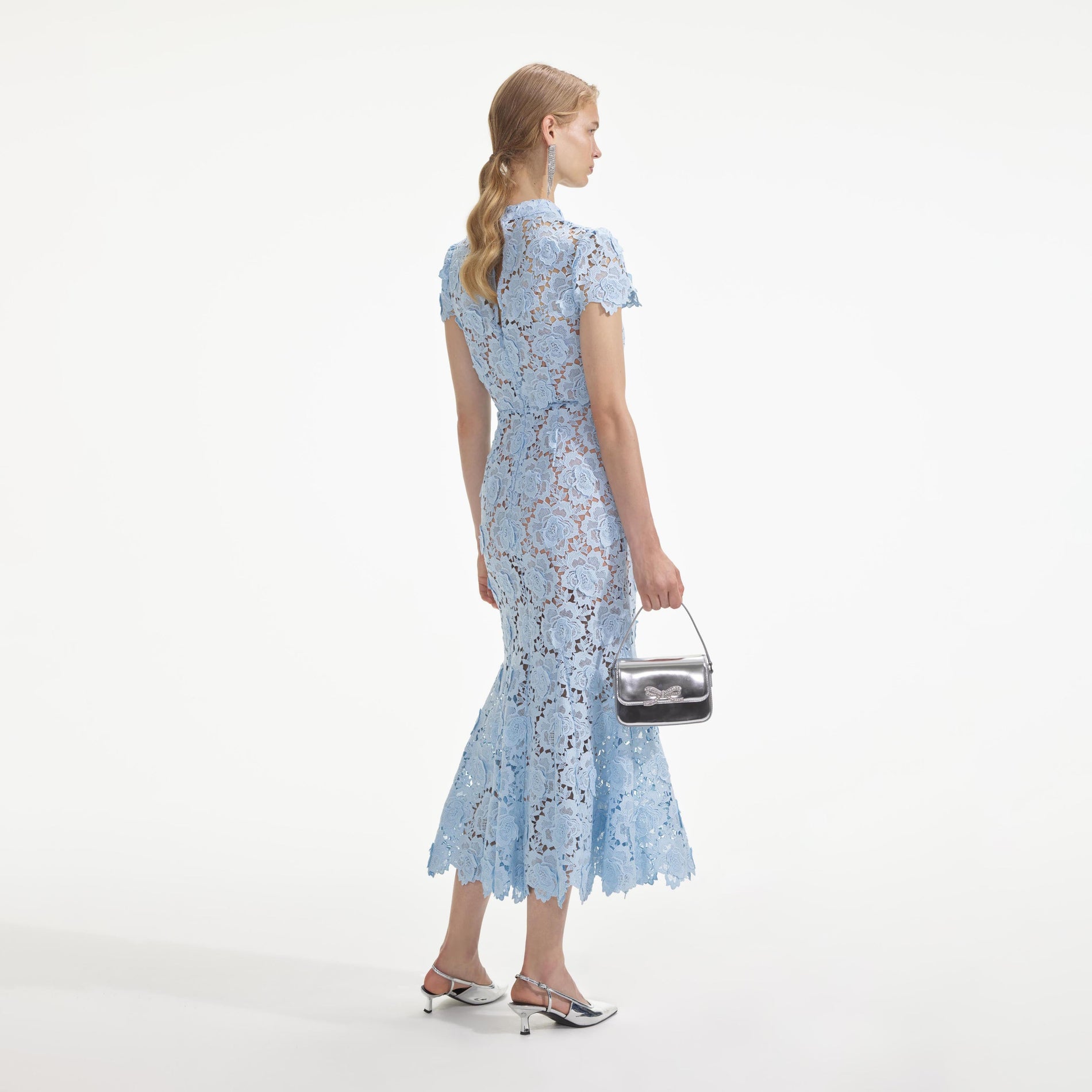 Back view of a woman wearing the Blue Flower Lace Midi Dress