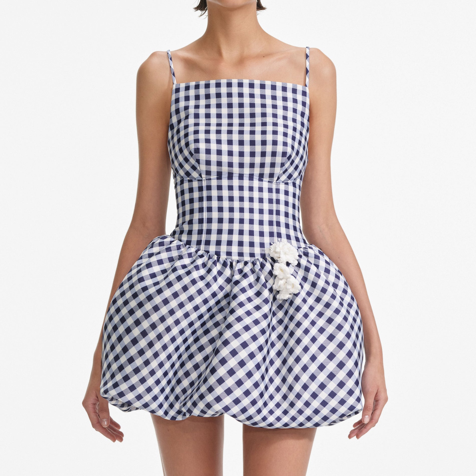 A close up of a woman wearing the Navy Gingham Taffeta Mini Dress