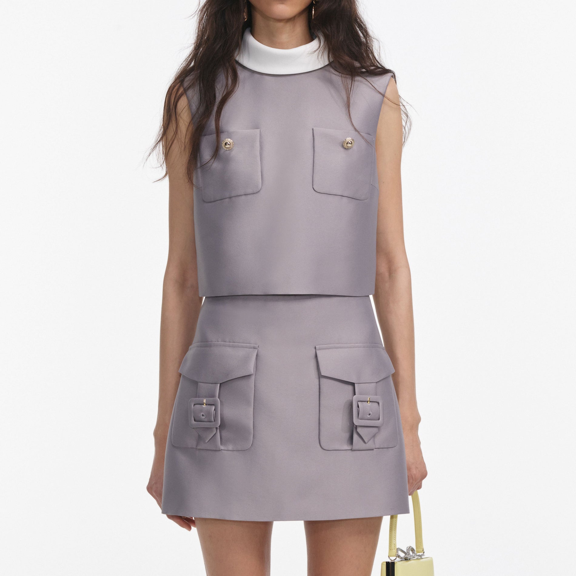 A close up of a woman wearing the Grey Taffeta Top