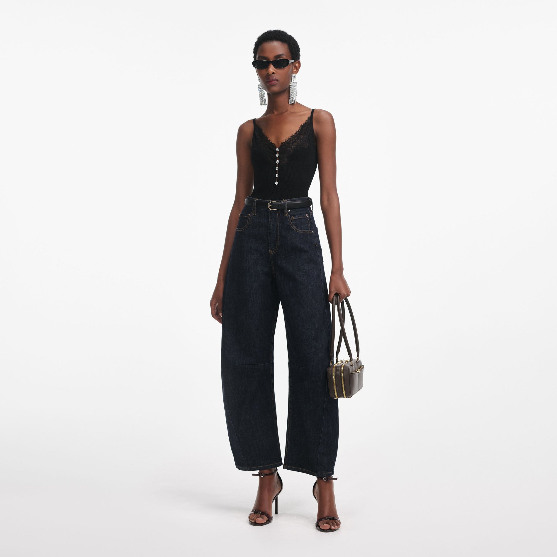 Side view of a woman wearing the Black Lace Trim Rib Knit Top