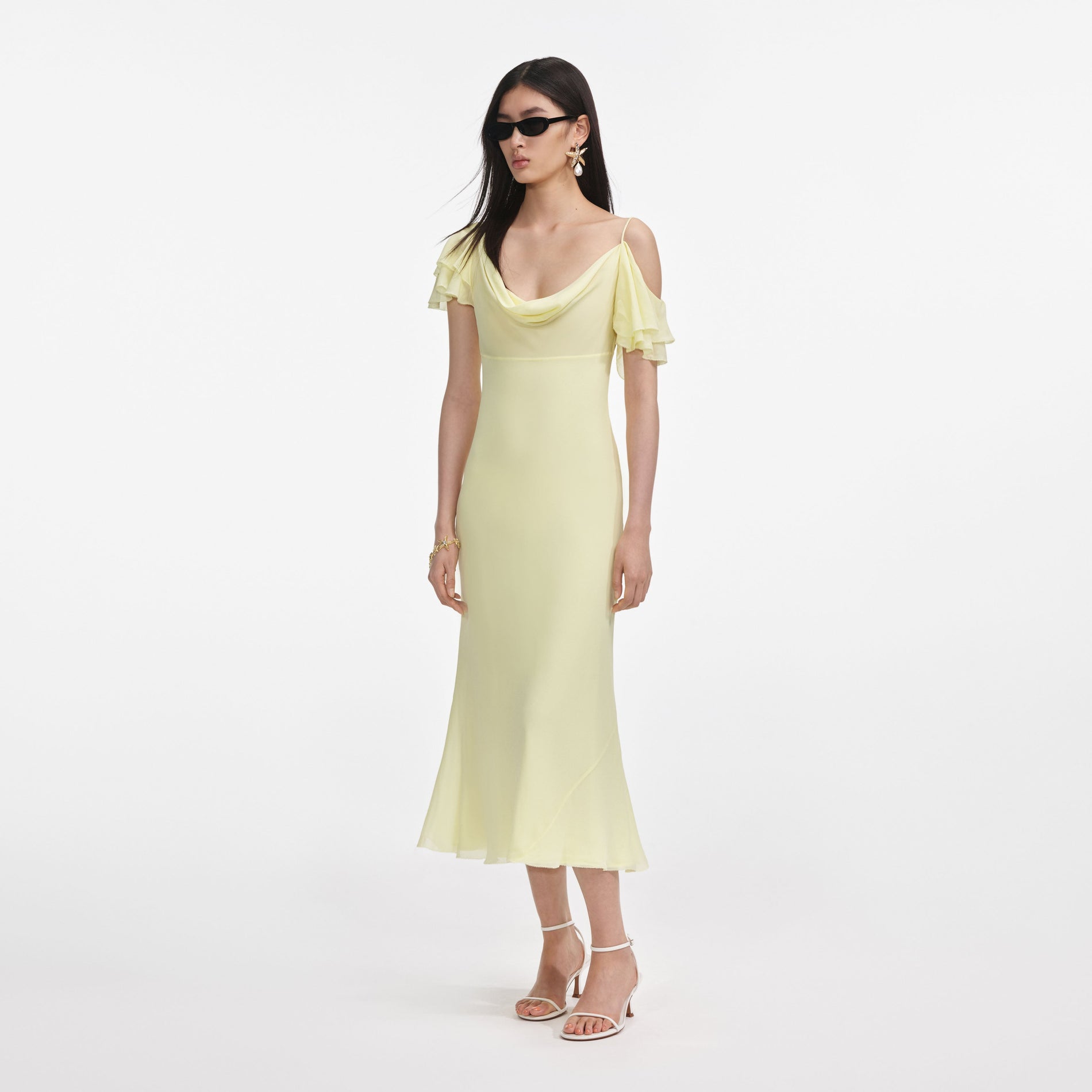 Side view of a woman wearing the Yellow Georgette Frill Midi Dress