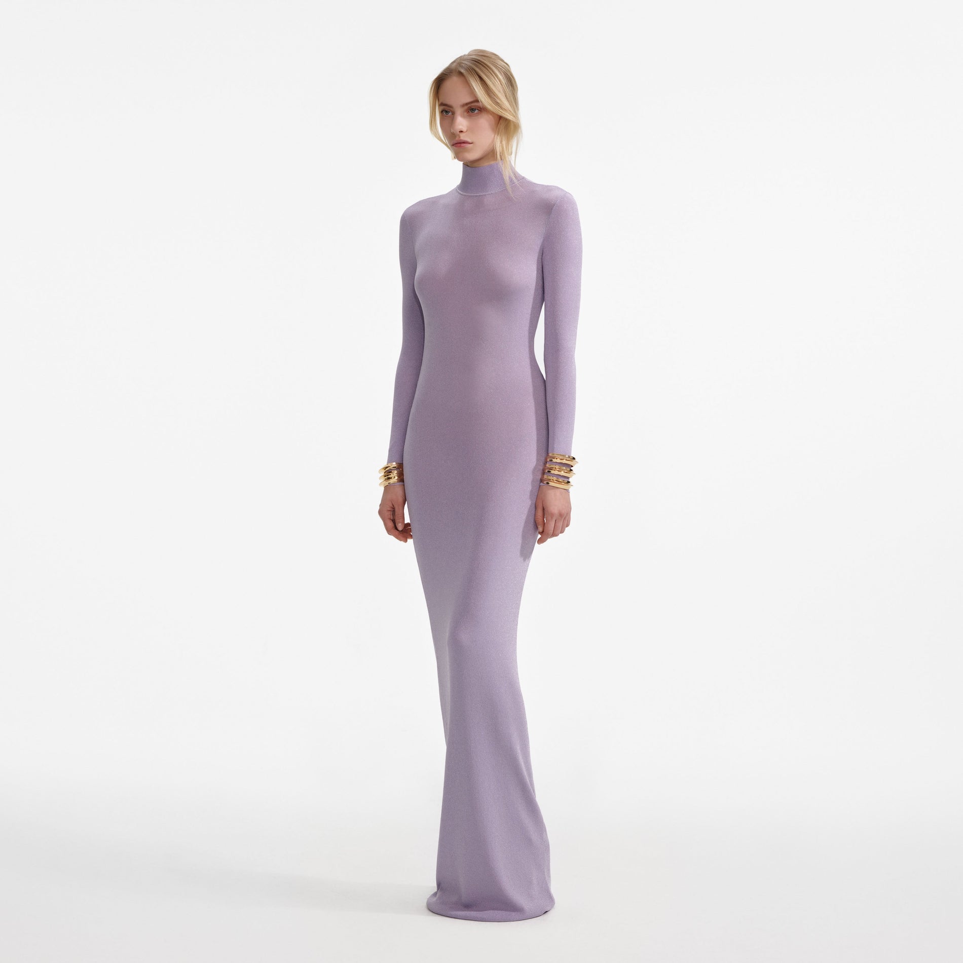 Side view of a woman wearing the Lilac Viscose Knit Maxi Dress