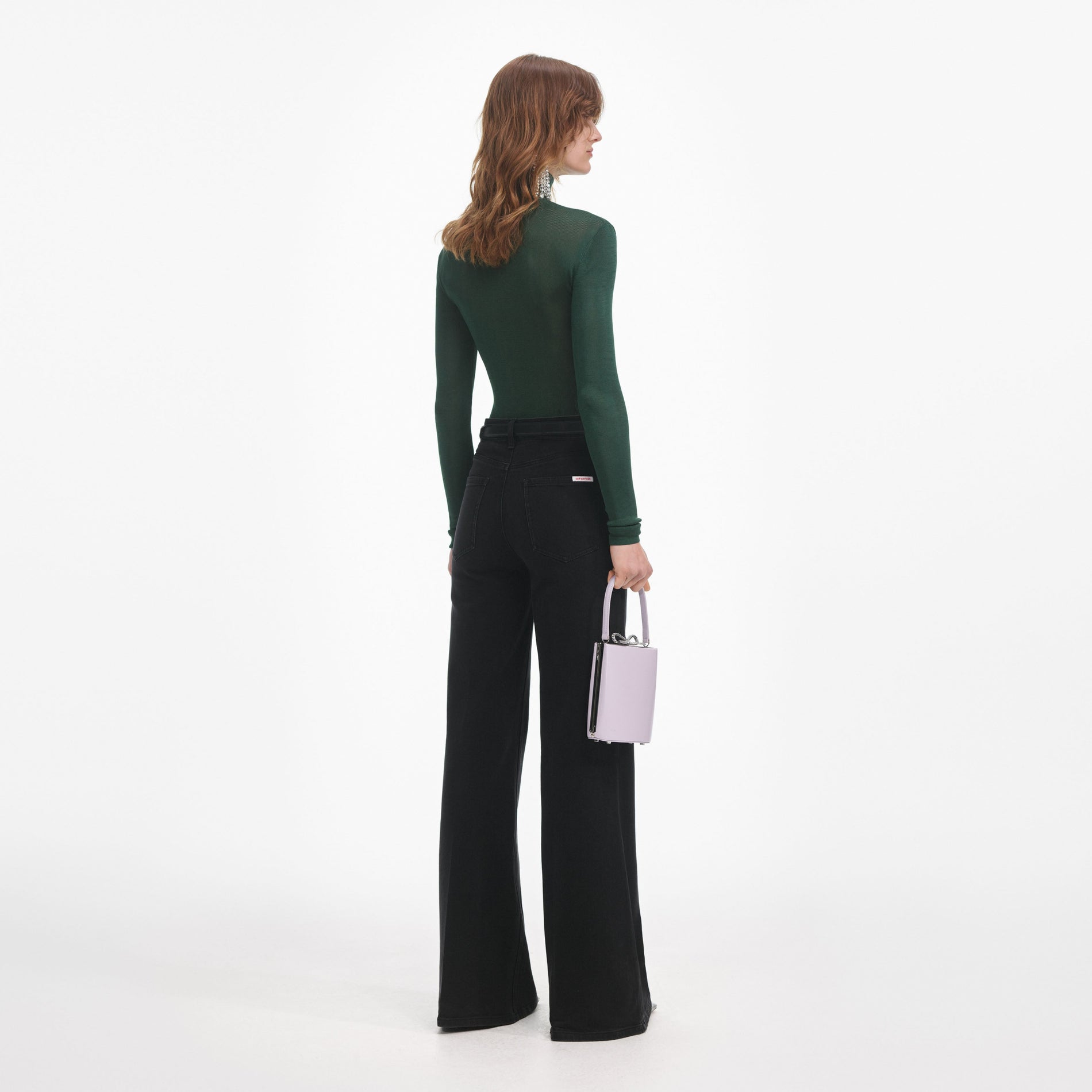 Back view of a woman wearing the Green Viscose Knit Top