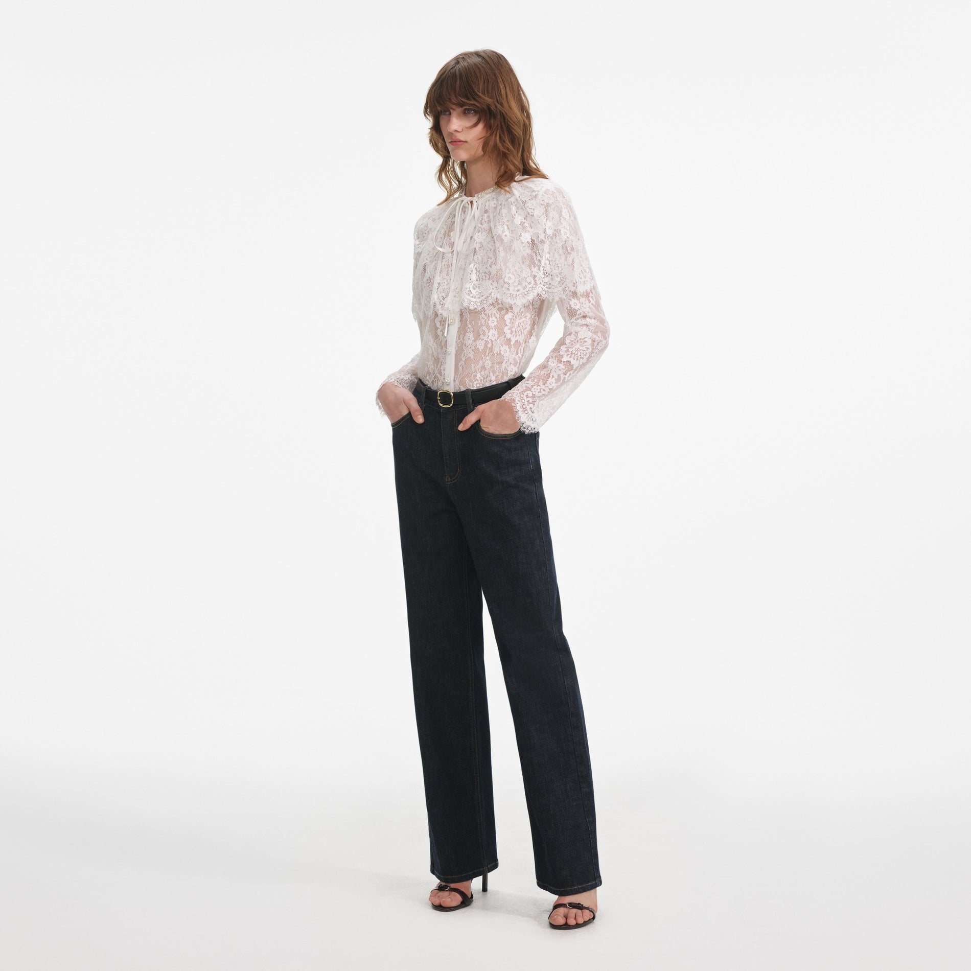 Side view of a woman wearing the Indigo Straight Leg Jeans