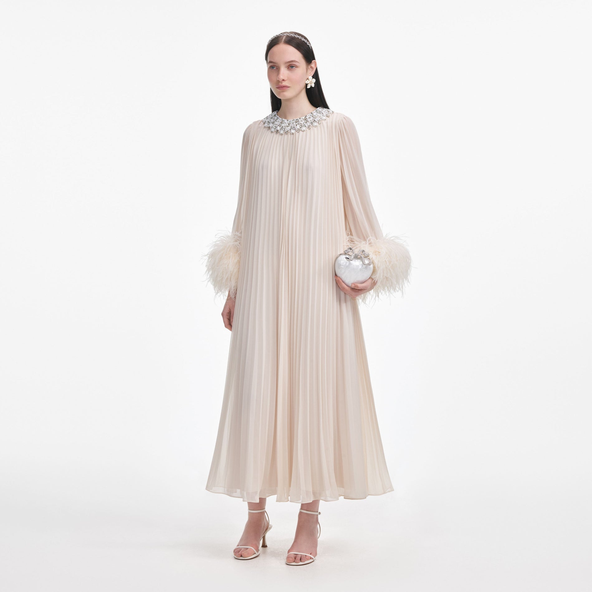Side view of a woman wearing the Cream Chiffon Feather Midi Dress