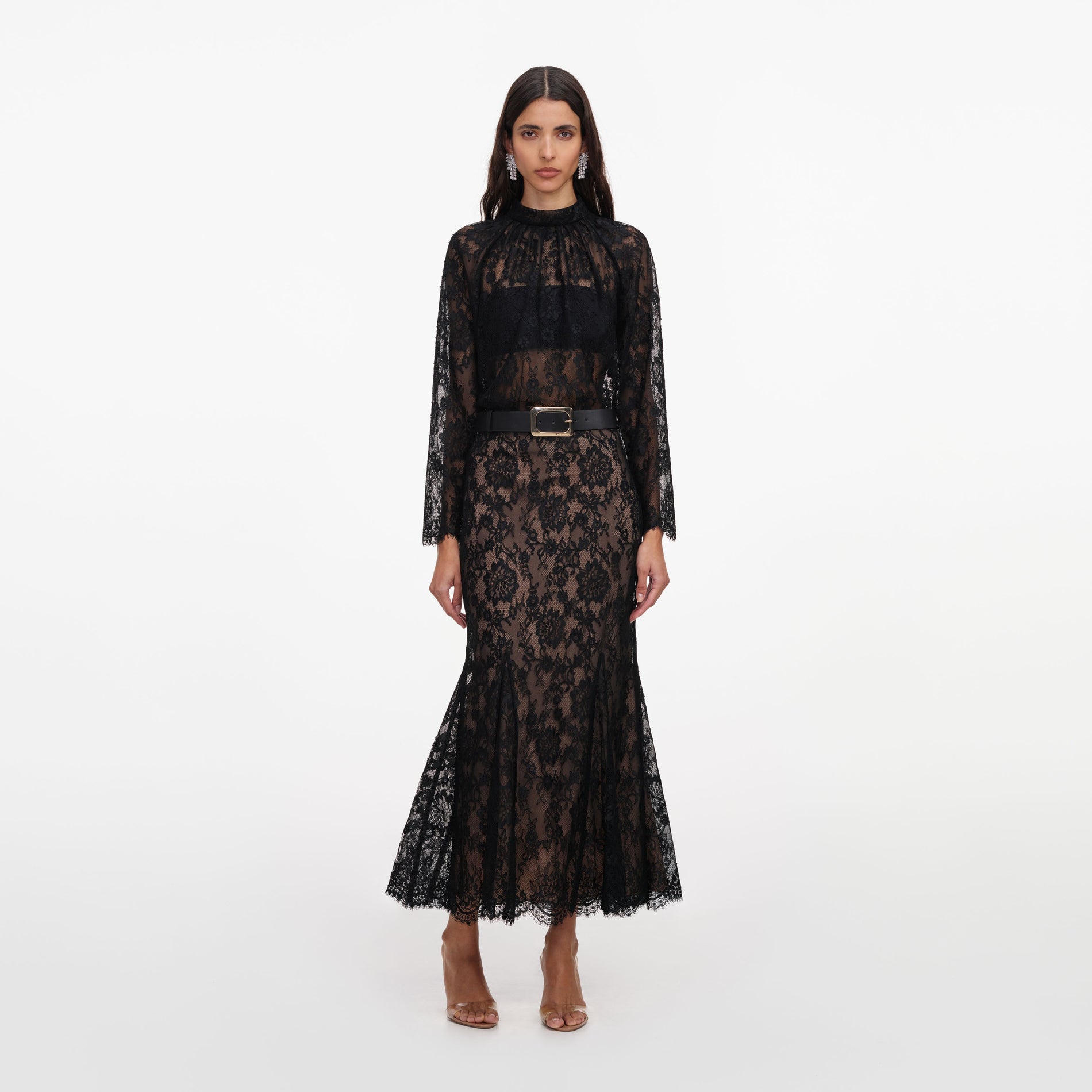 Front view of a woman wearing the Black Lace Midi Skirt