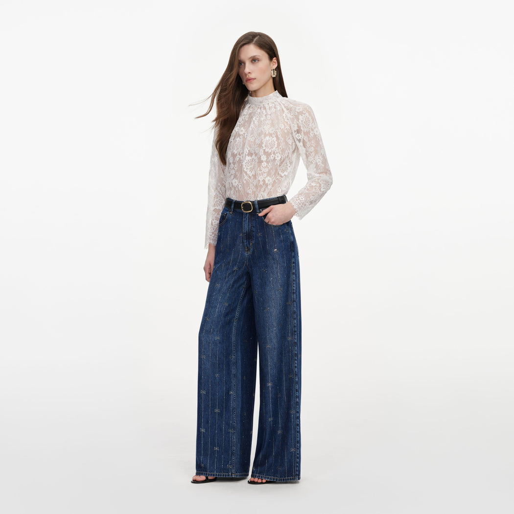 Side view of a woman wearing the Rhinestone Stripe Denim Jeans