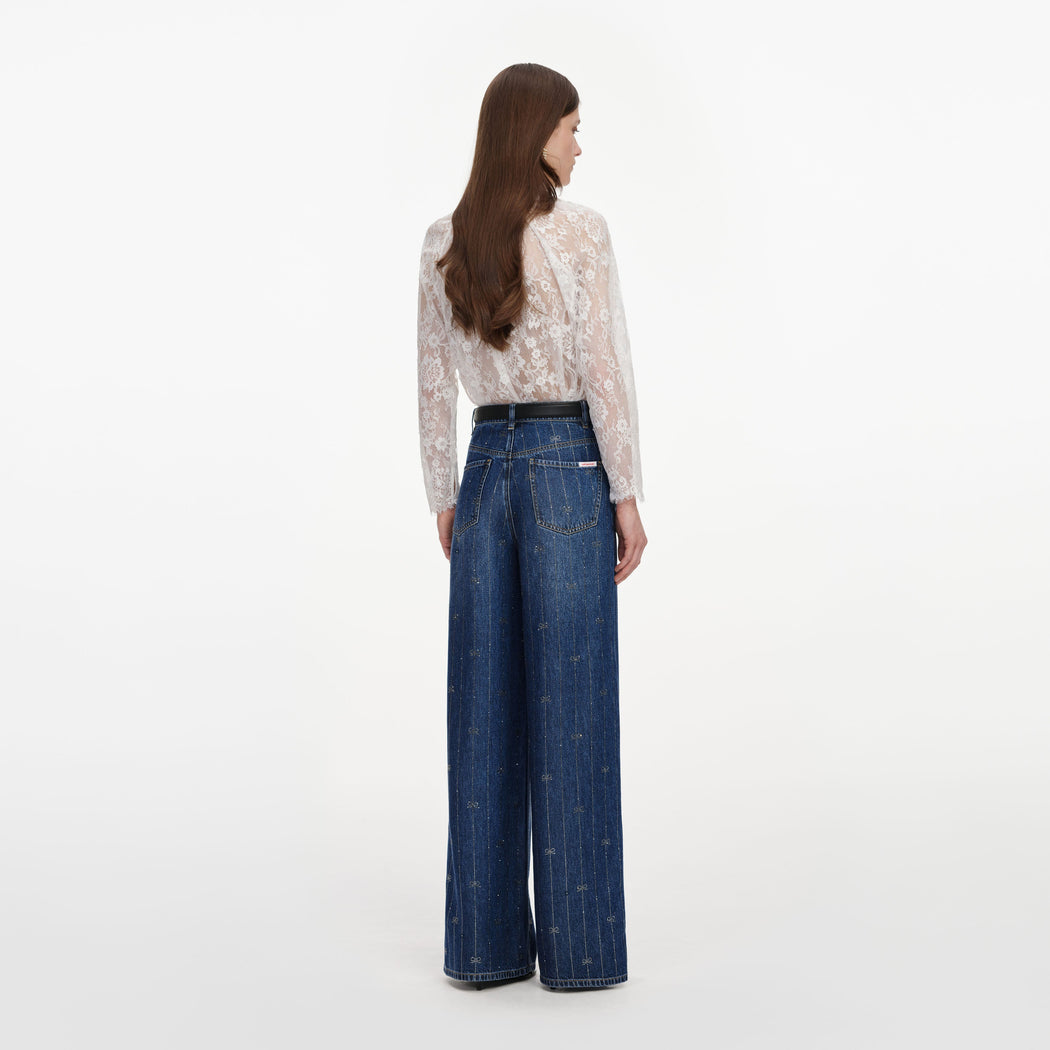 Back view of a woman wearing the Rhinestone Stripe Denim Jeans