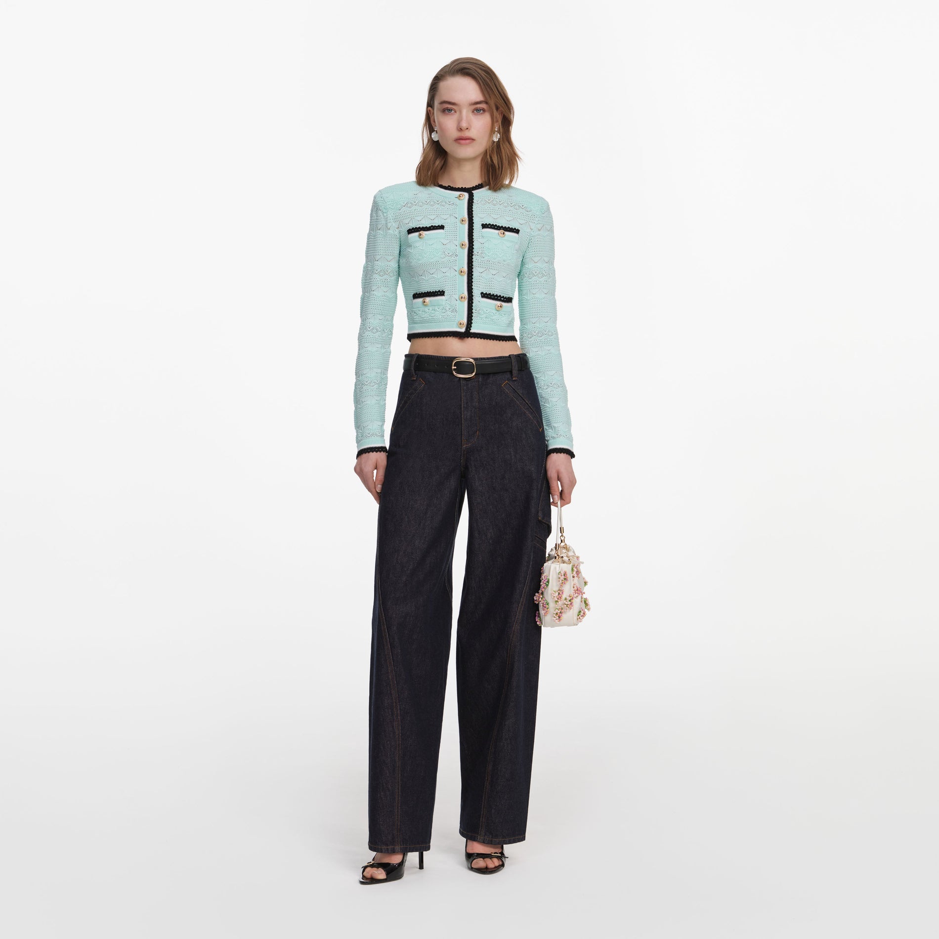 Front view of a woman wearing the Mint Pointelle Knit Cardigan