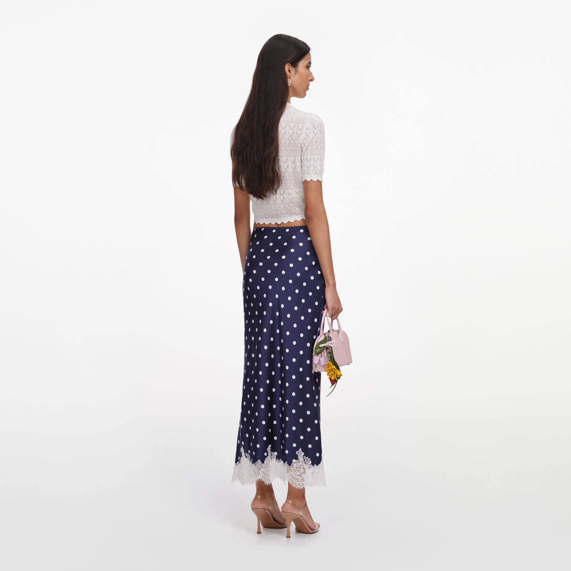 Back view of a woman wearing the White Pointelle Knit Top