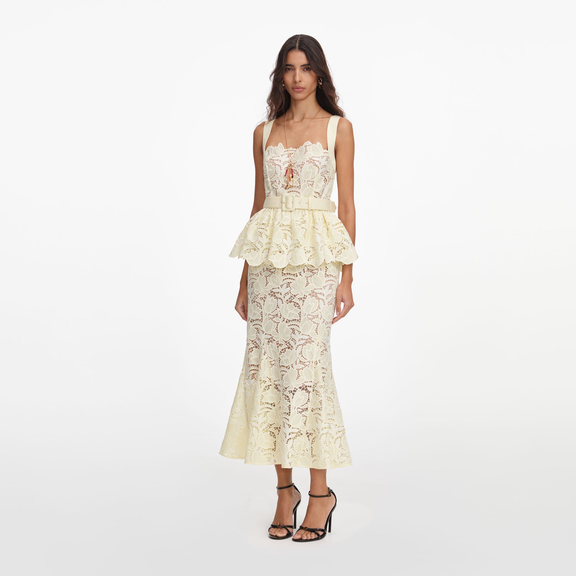 Side view of a woman wearing the Yellow Lace Peplum Midi Dress