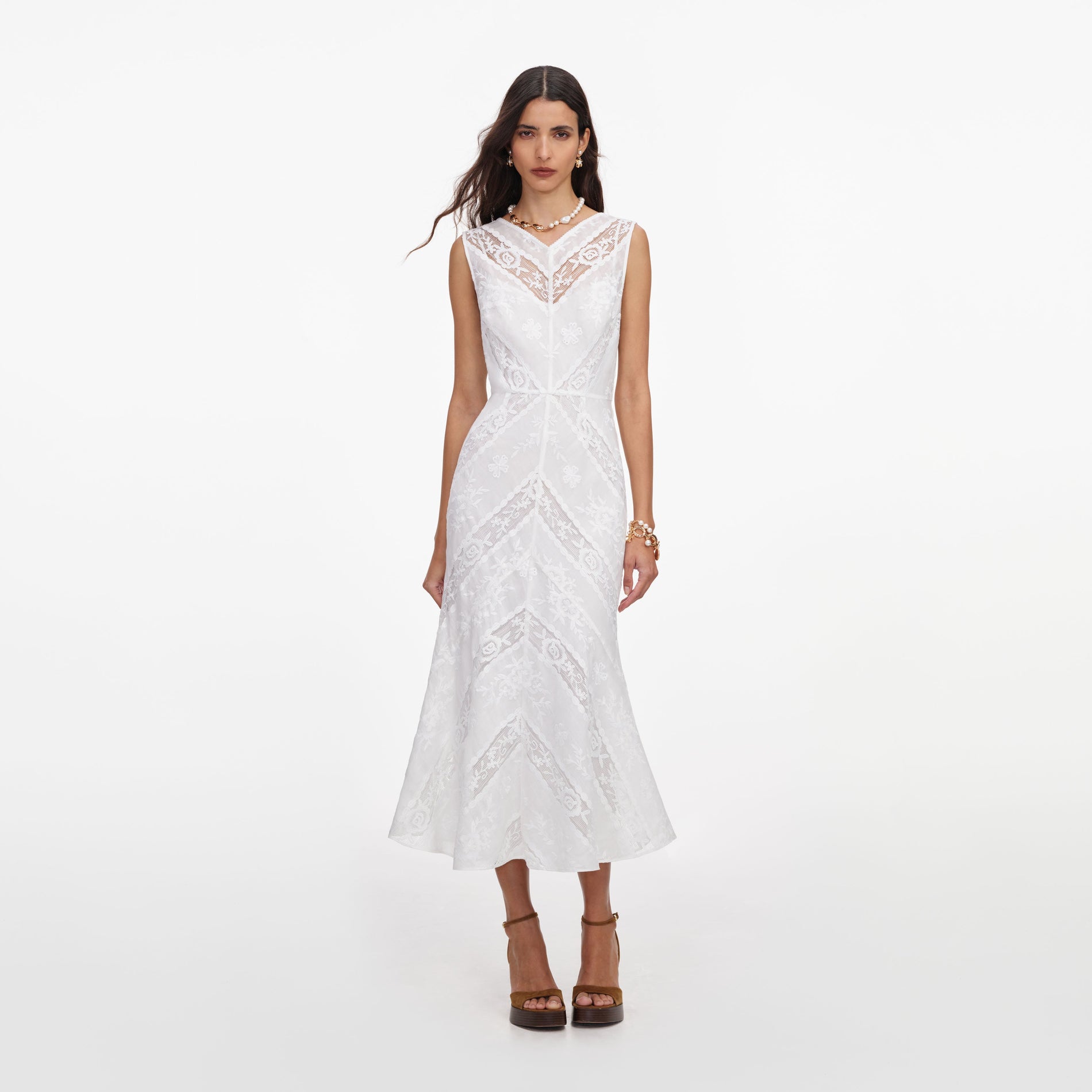 Front view of a woman wearing the White Ramie Sleeveless Midi Dress