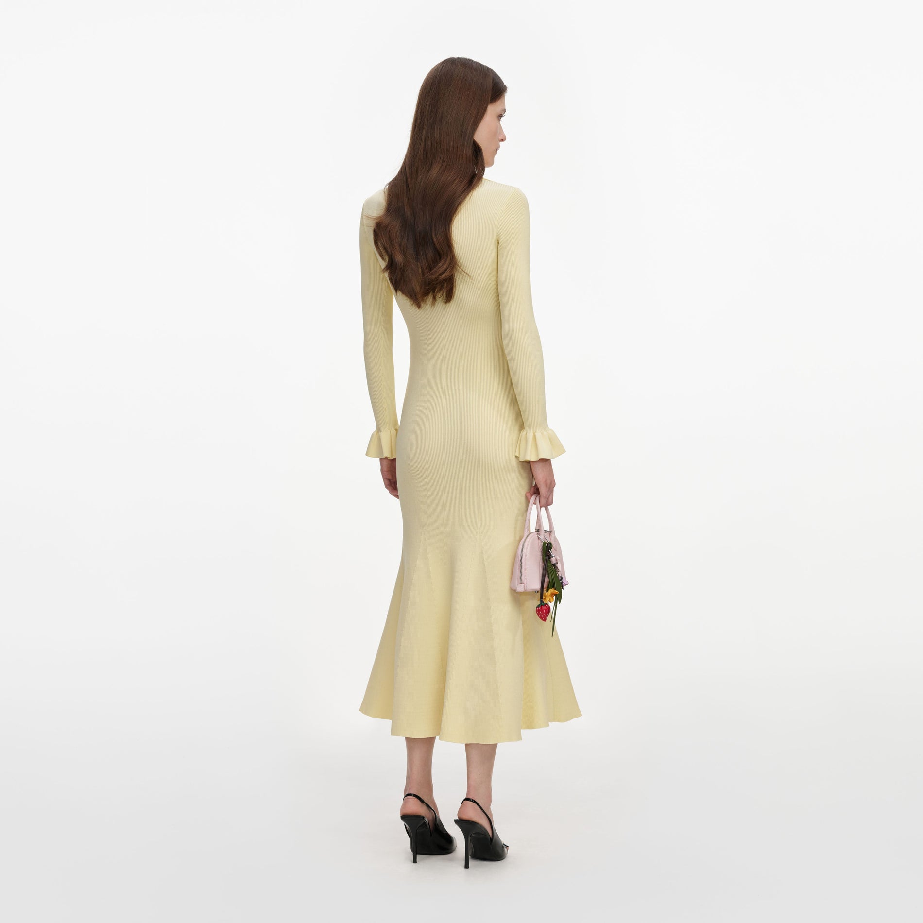 Back view of a woman wearing the Yellow Viscose Knit Tie Midi Dress