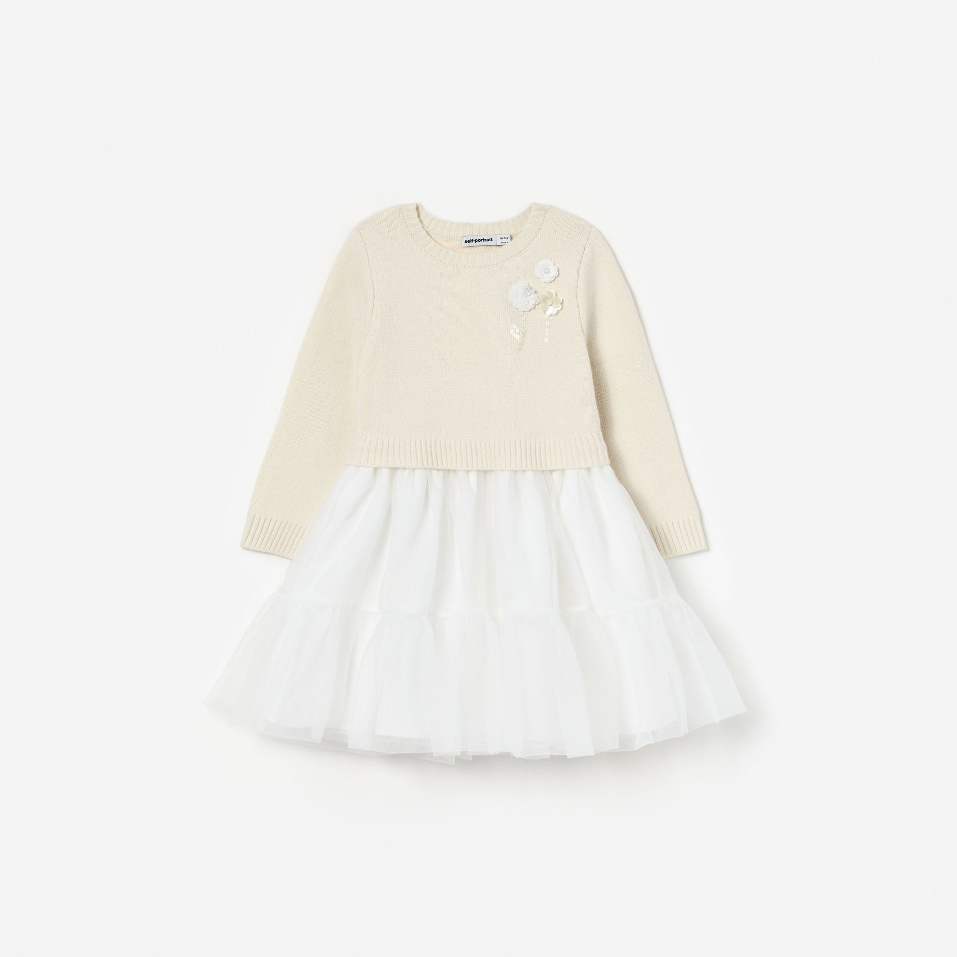 Cream knit top with white tulle skirt and floral embellishments