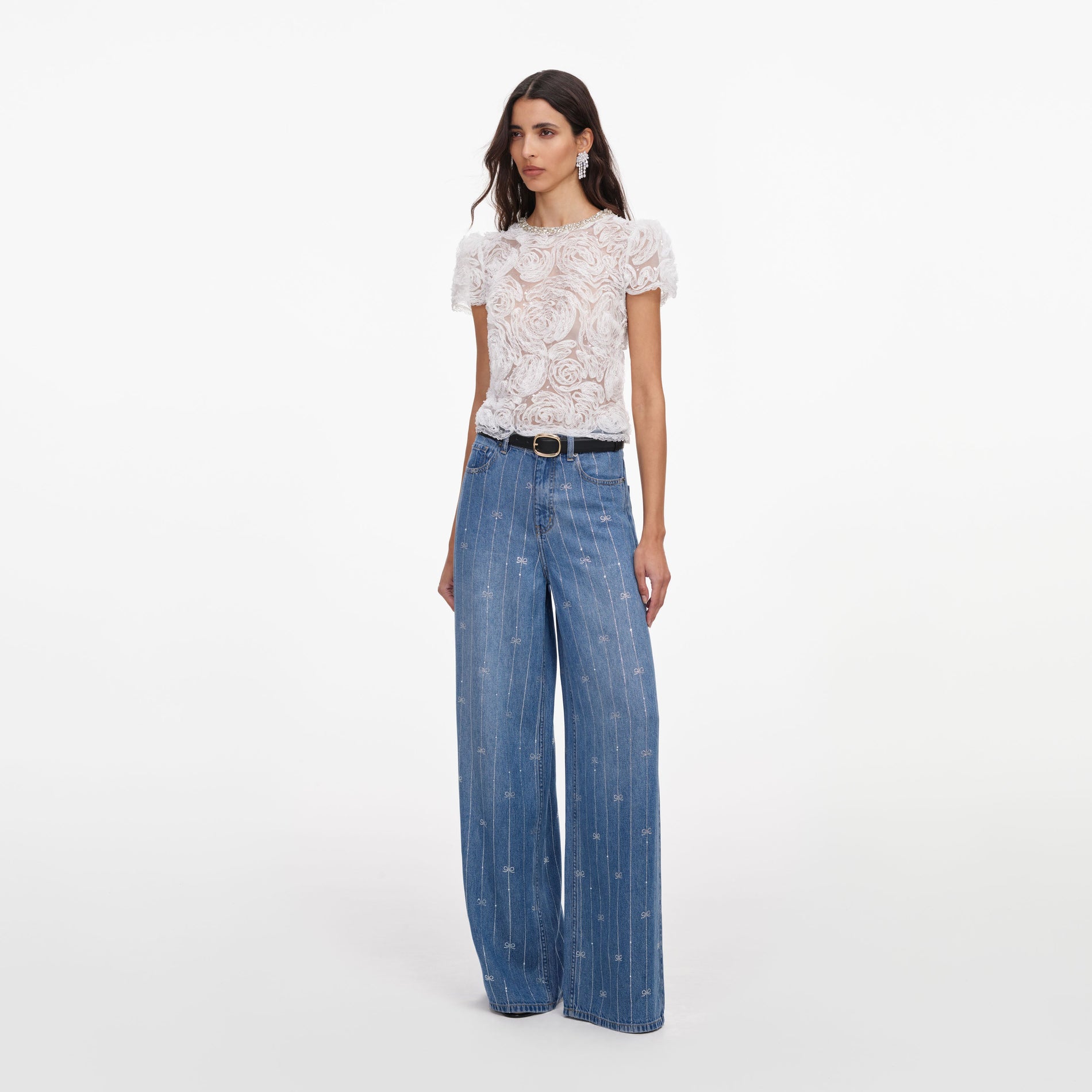 Side view of a woman wearing the Light Blue Rhinestone Stripe Denim Jeans