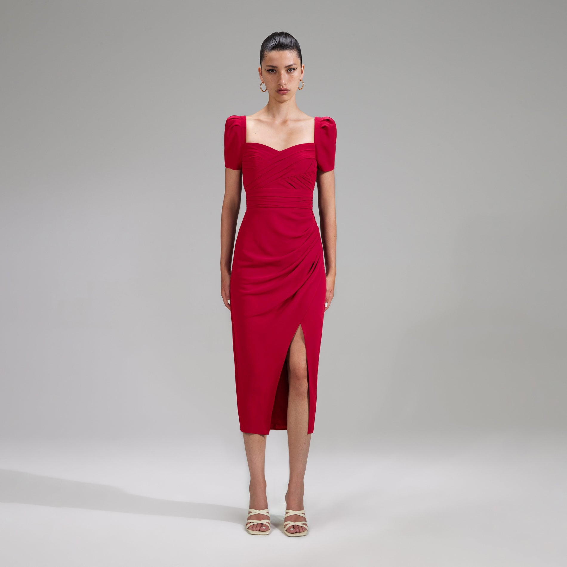 A woman wearing the Red Iris Midi Dress