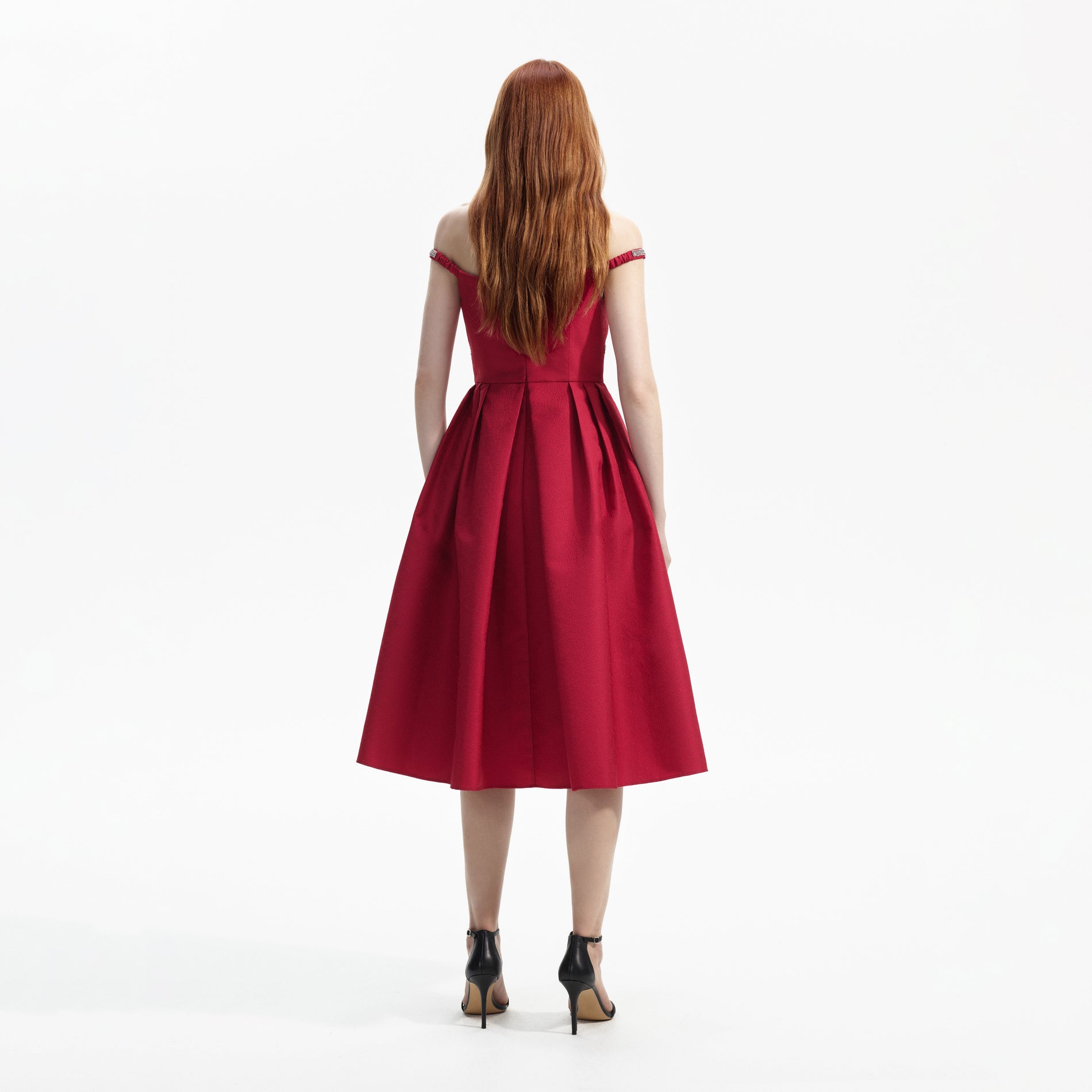 Back view of a woman wearing the Red Textured Diamante Midi Dress