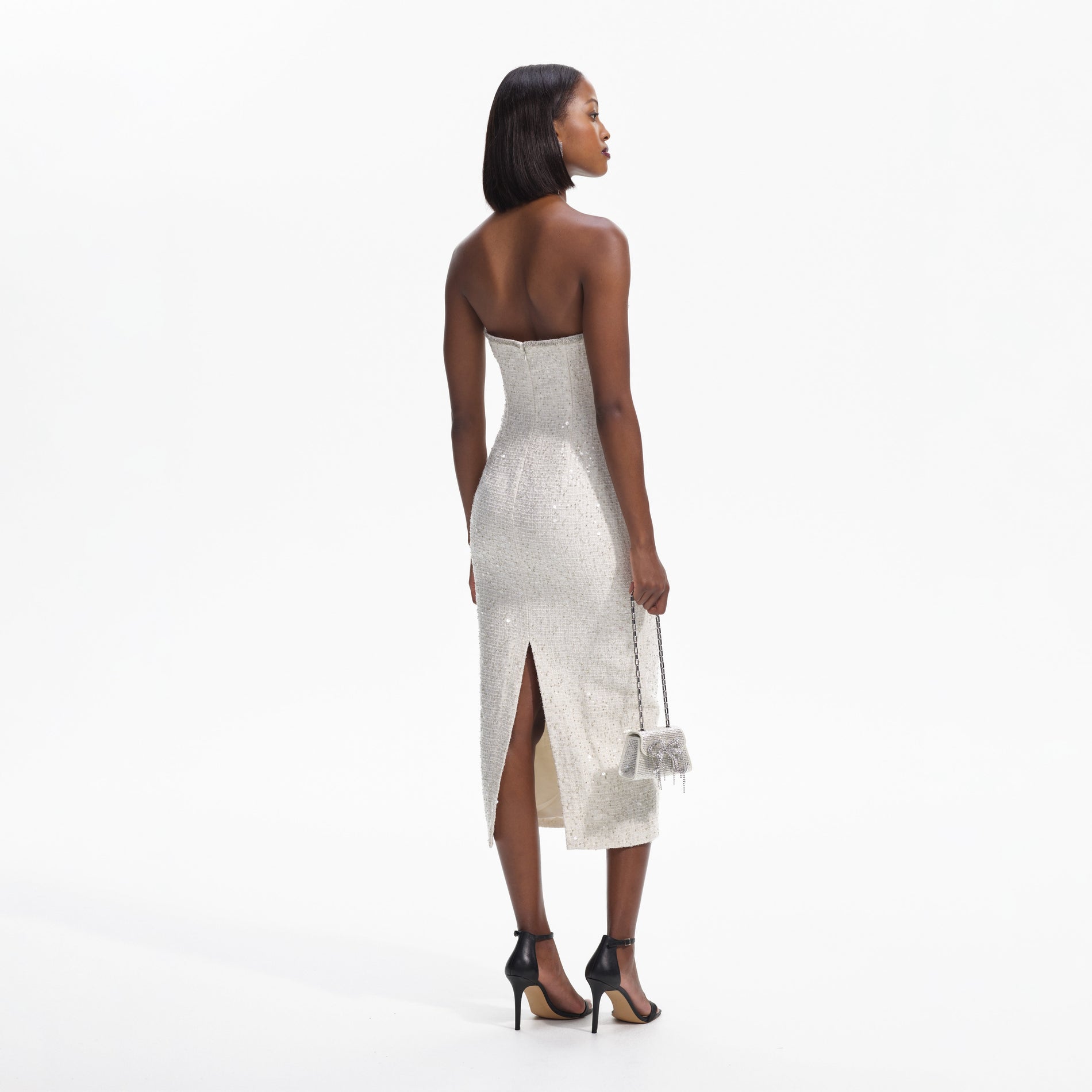 Back view of a woman wearing the Cream Sequin Boucle Strapless Midi Dress