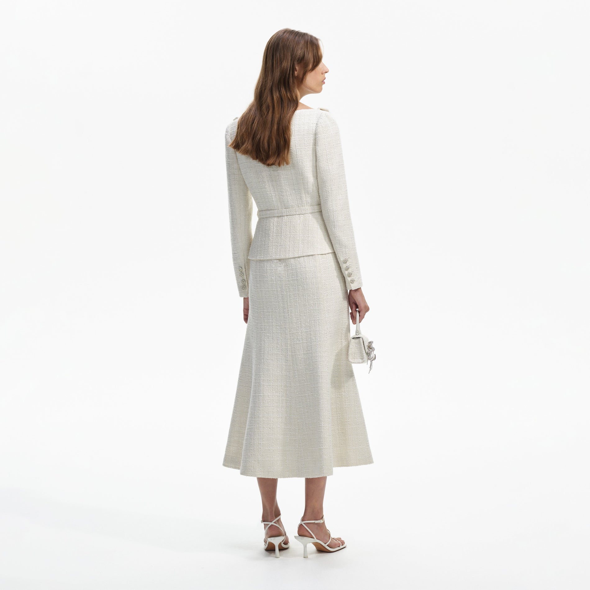 Back view of a woman wearing the Cream Boucle Tailored Off Shoulder Midi Dress