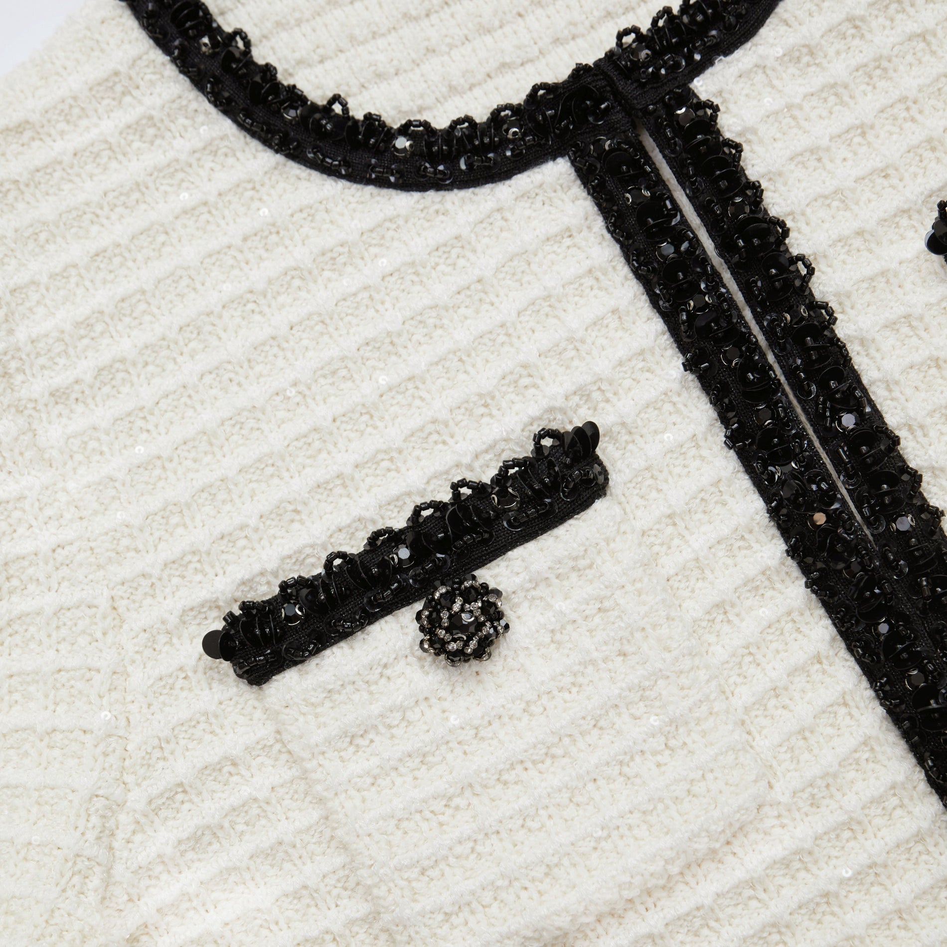 A close up of a woman wearing the Cream Textured Knit Cardigan