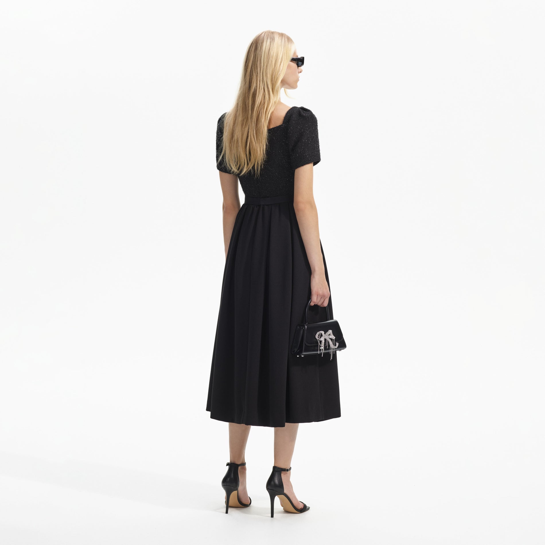 Back view of a woman wearing the Black Boucle Square Neck Midi Dress