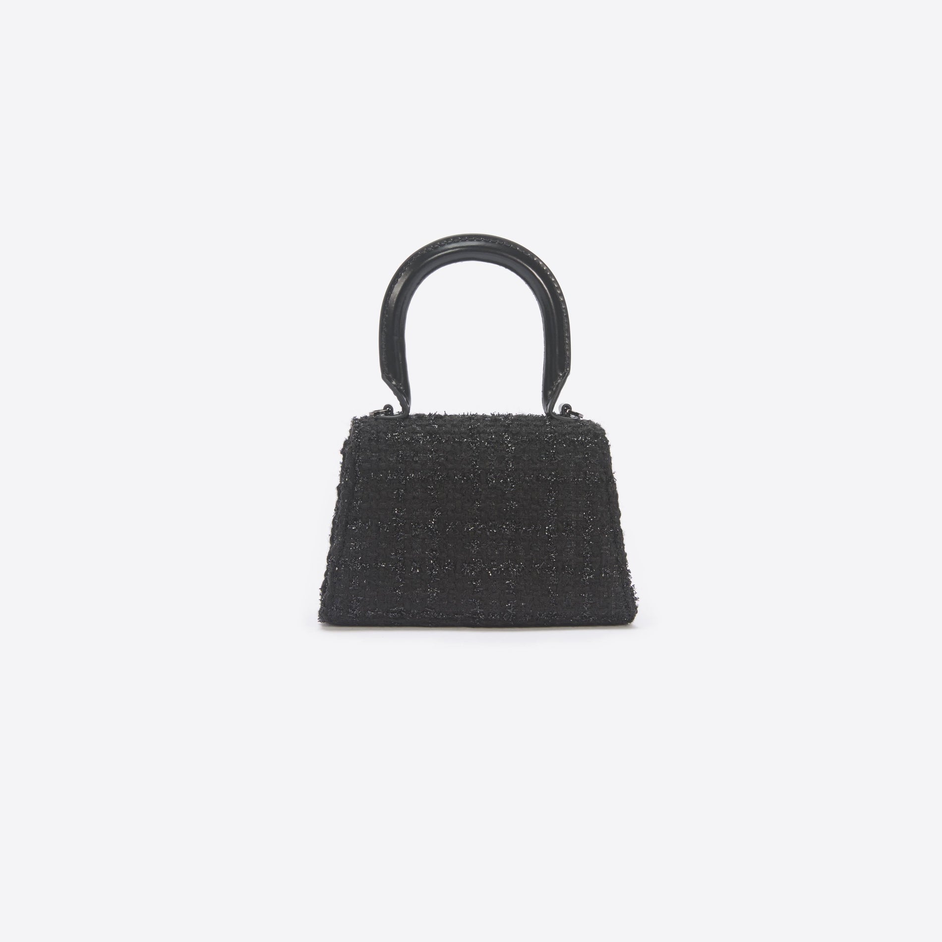 Back view of a woman wearing the Black Boucle Micro Bow Bag