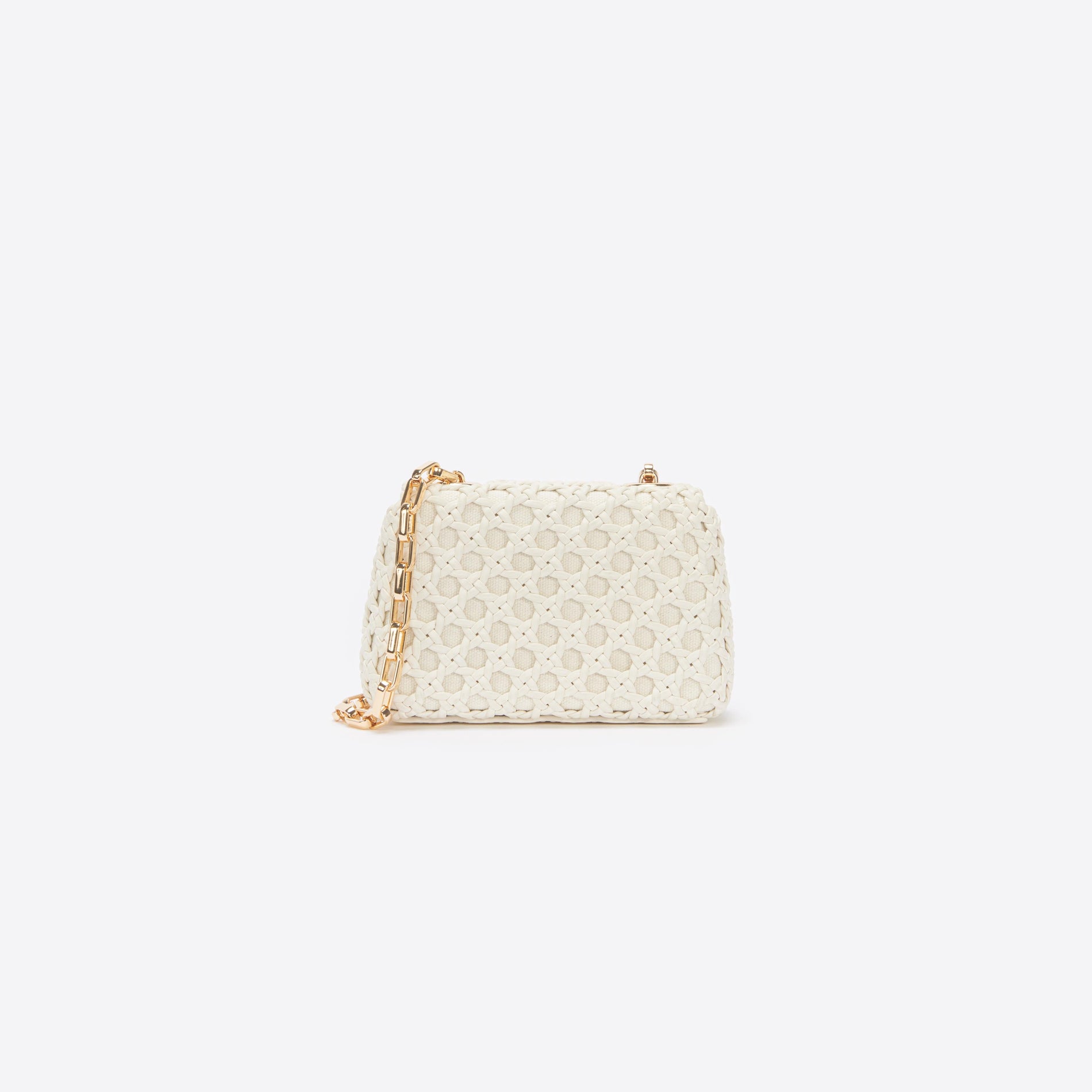 Back view of a woman wearing the Cream Woven Leather Micro Bag