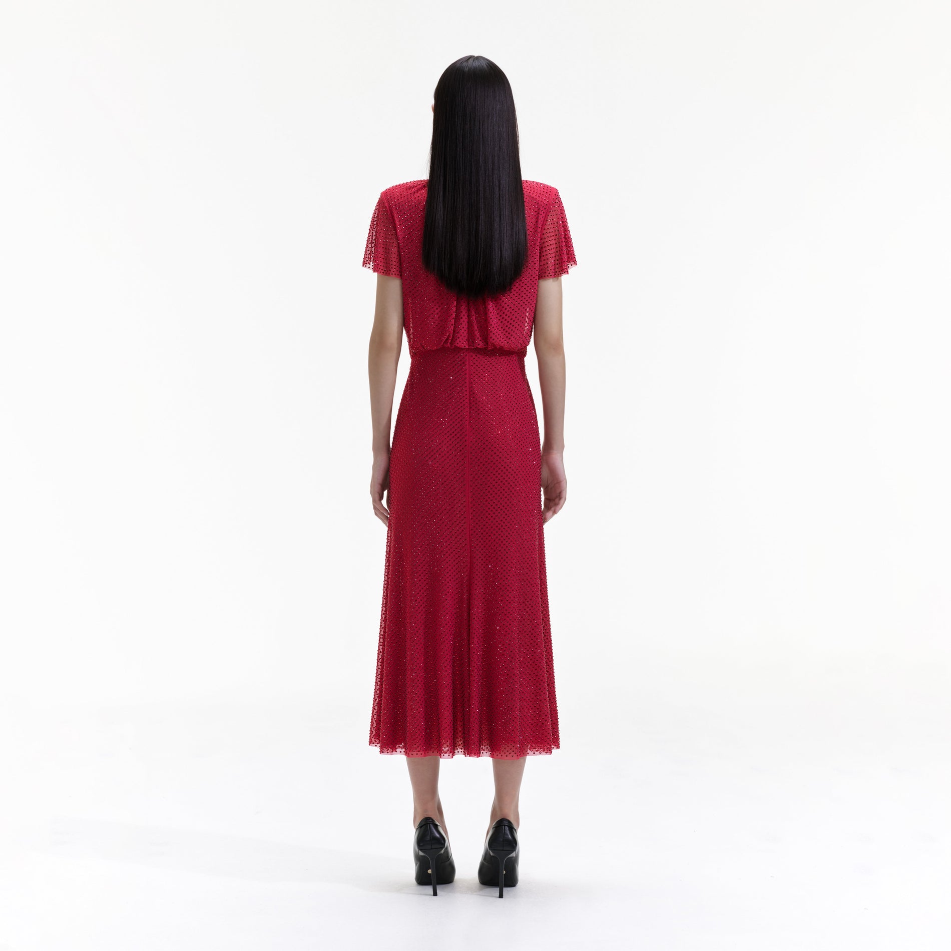 Back view of a woman wearing the Red Rhinestone Mesh Midi Dress