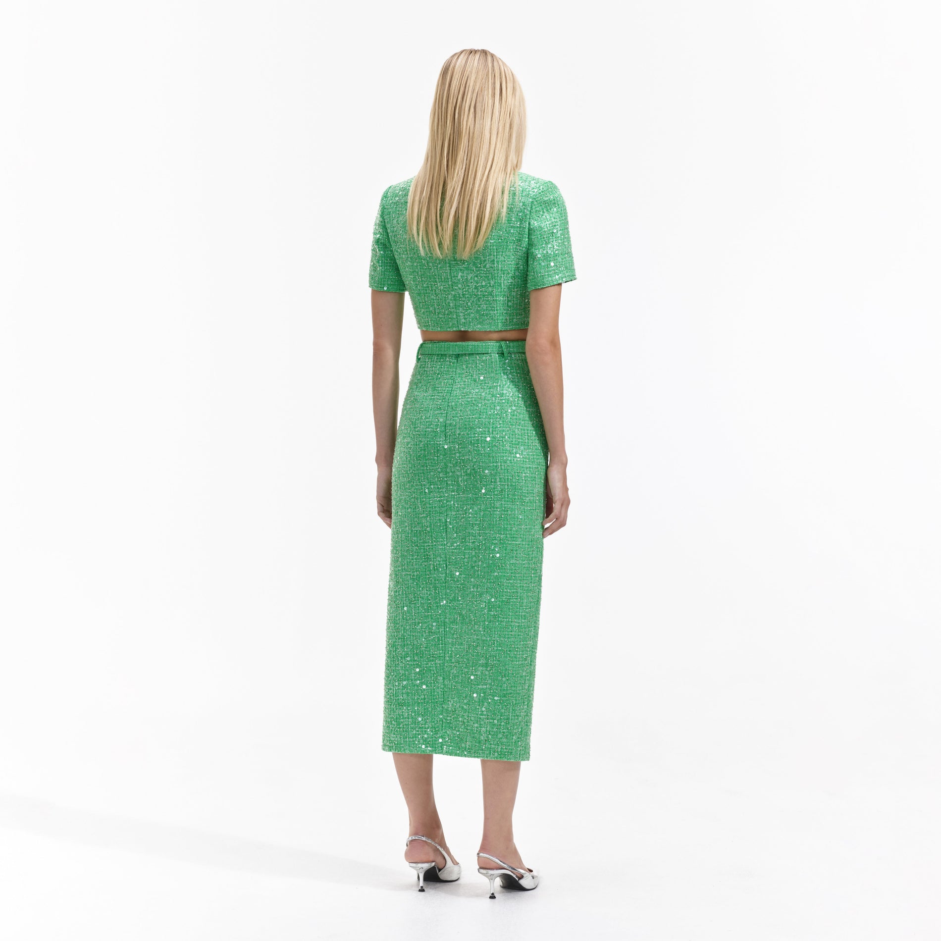 Back view of a woman wearing the Green Boucle Top