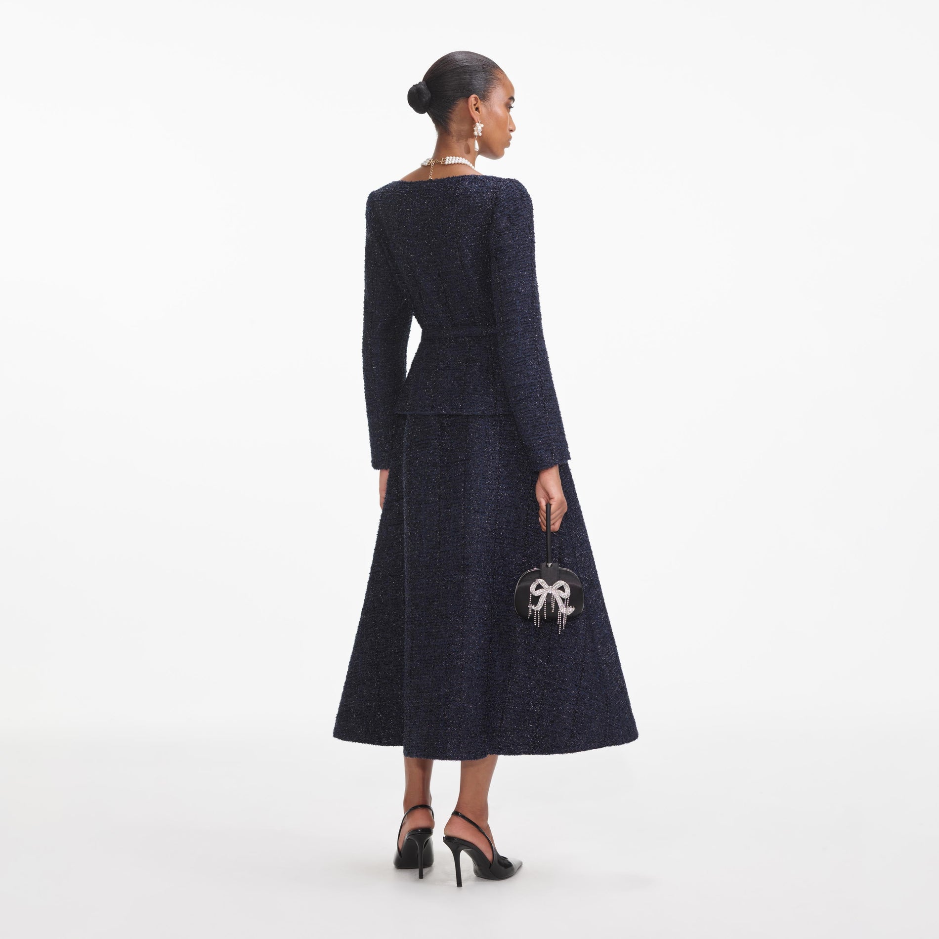 Back view of a woman wearing the Navy Metallic Boucle Midi Dress