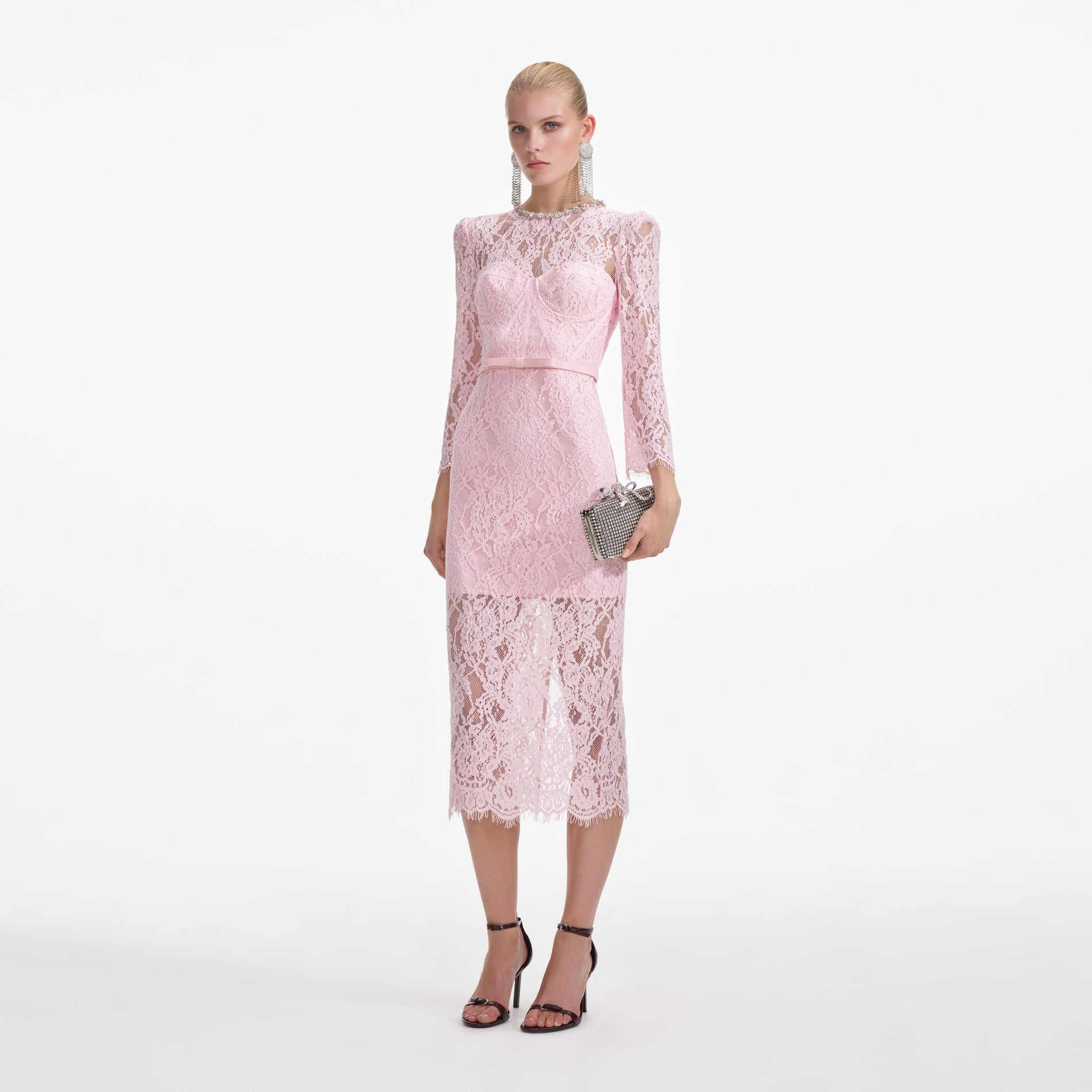 Side view of a woman wearing the Pink Lace Bustier Midi Dress