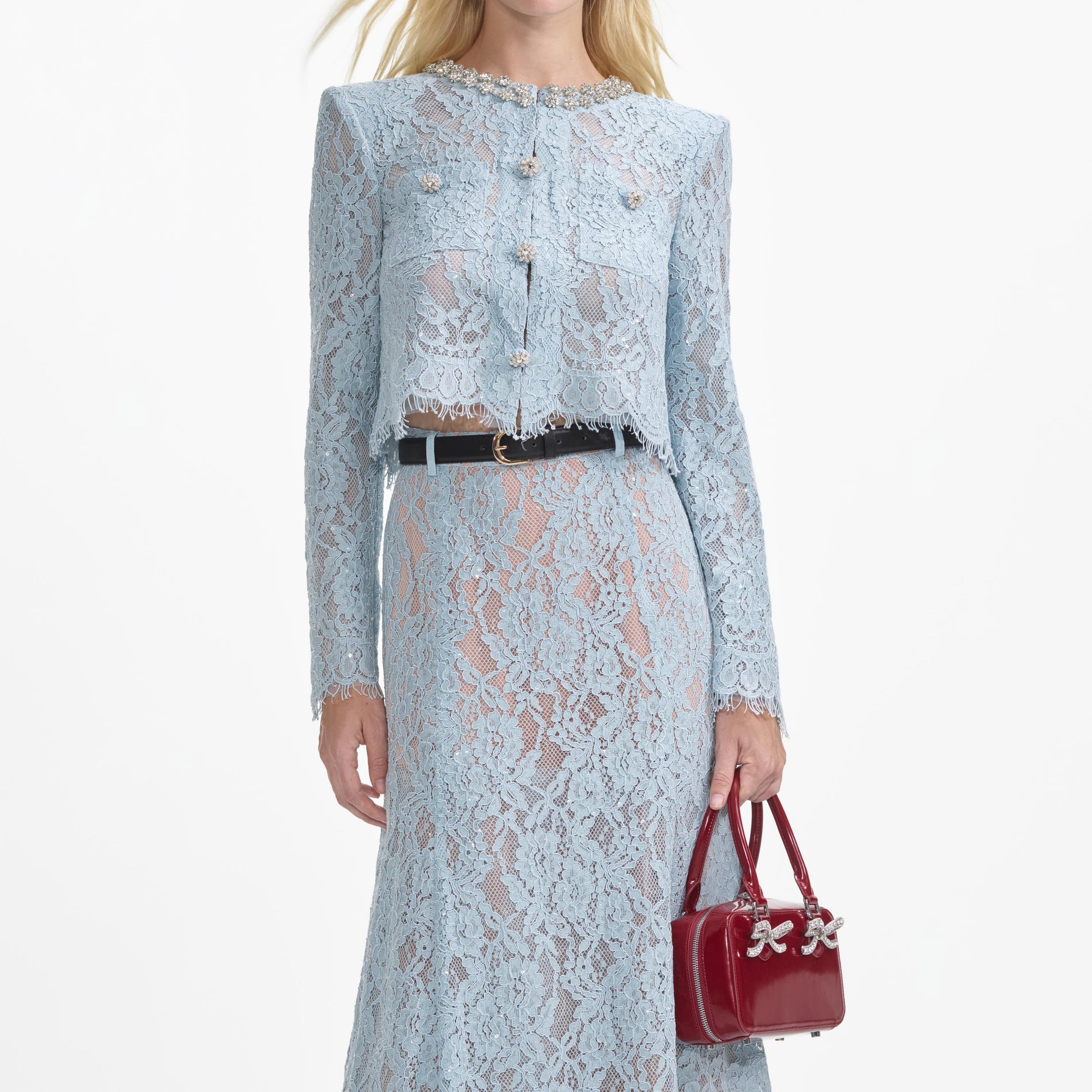 A close up of a woman wearing the Blue Lace Flared Midi Skirt