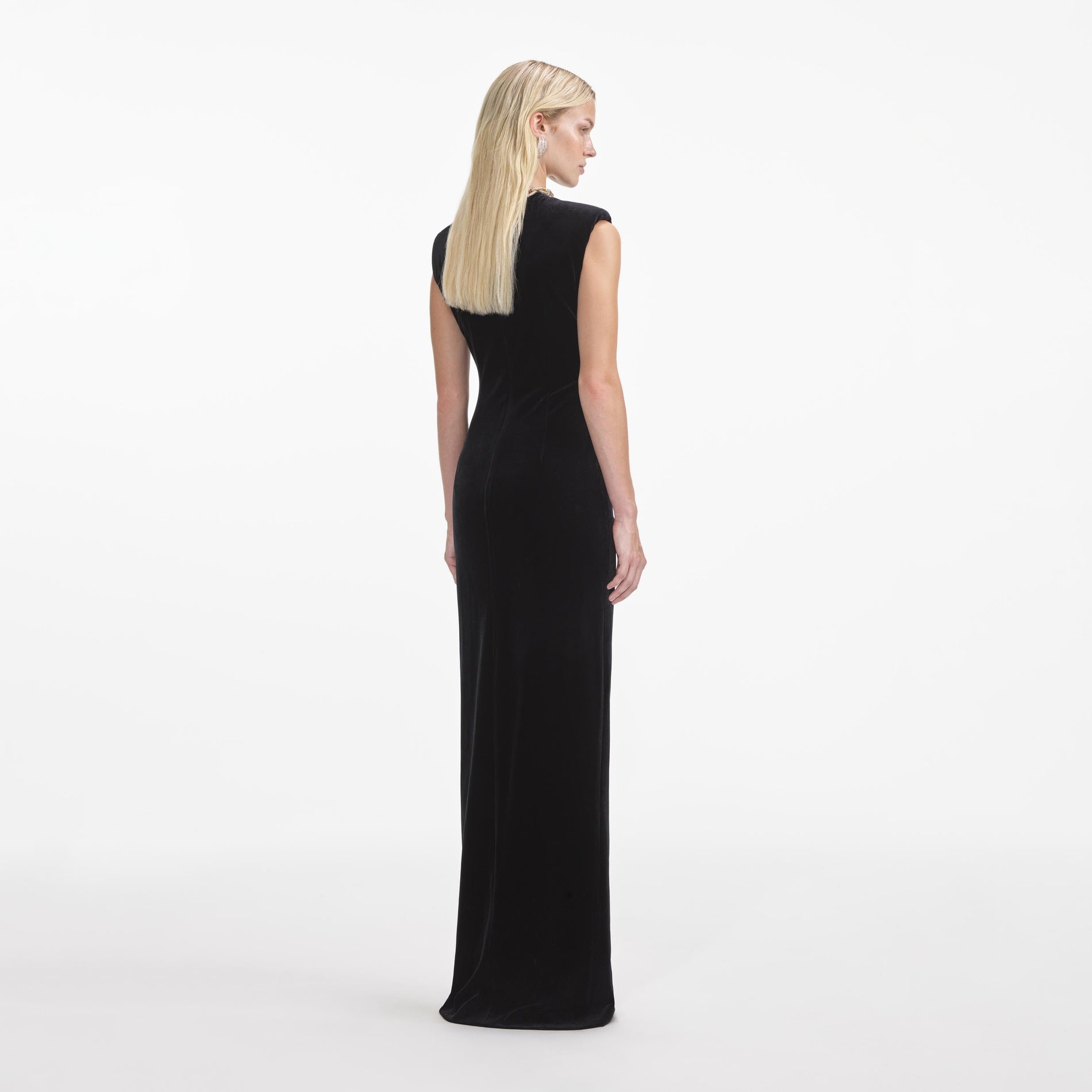 Back view of a woman wearing the Black Velvet Embellished Maxi Dress