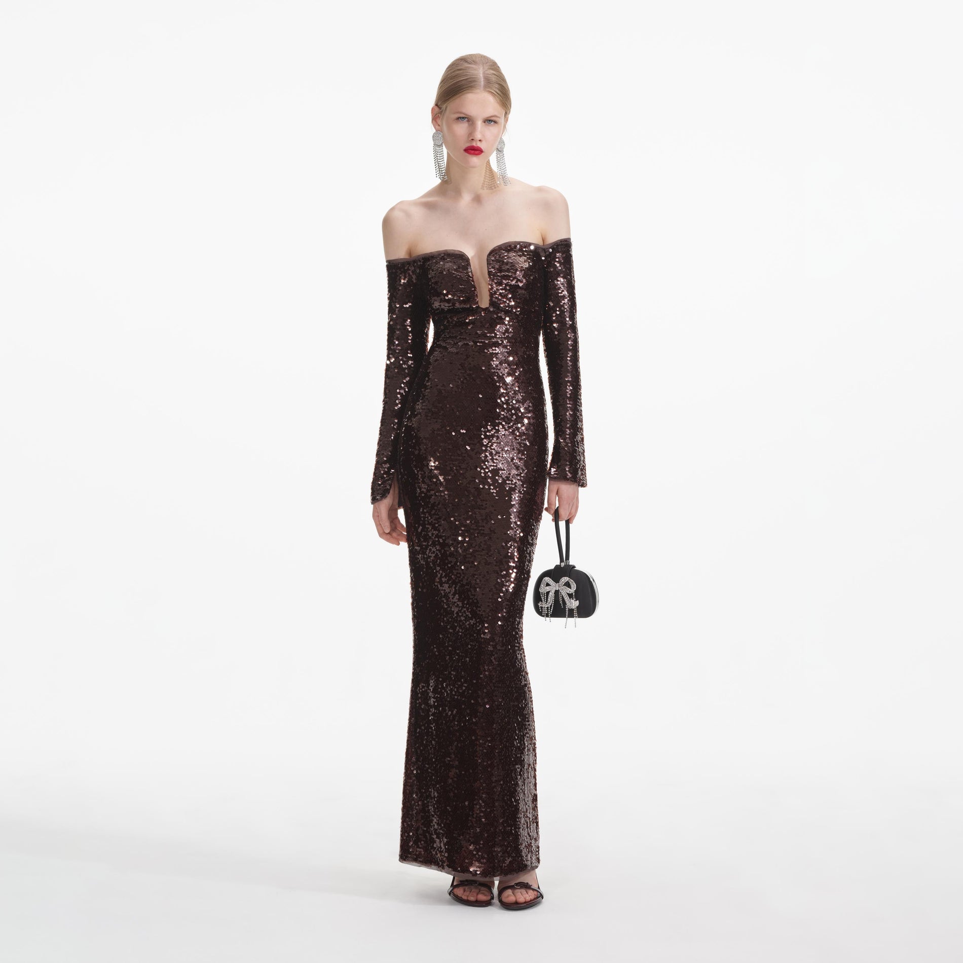 Front view of a woman wearing the Brown Sequin Off Shoulder Maxi Dress